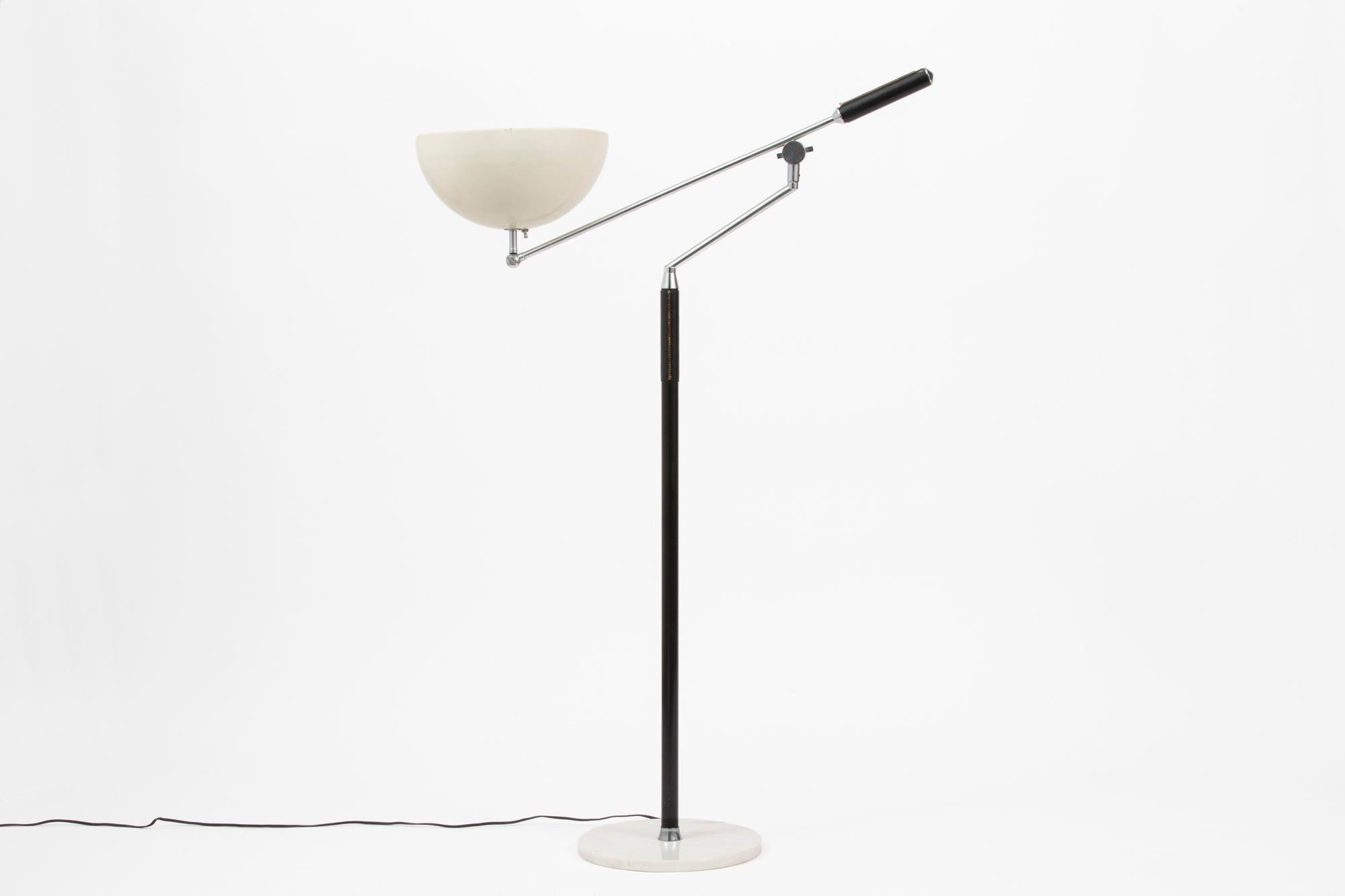 This unusual articulated, infinitely adjustable modernist vintage Italian floor lamp was distributed by Koch & Lowy during the 1960s and attributed to the manufacturer Arredoluce. It would make a great reading lamp as well as being great for