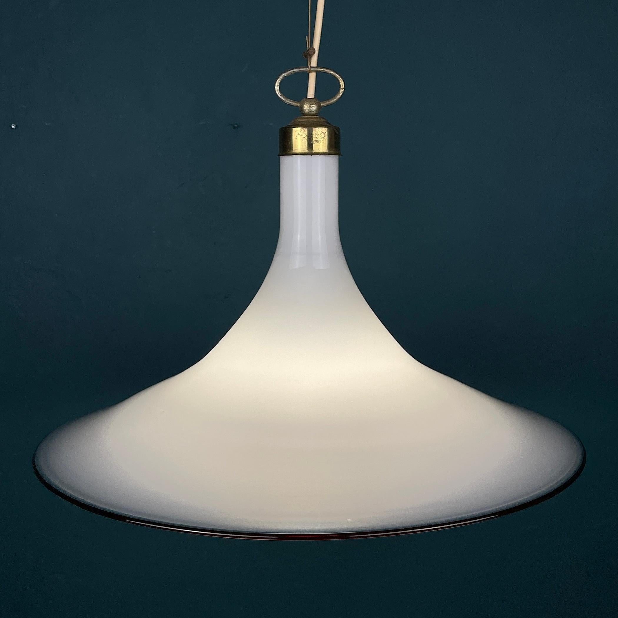 This mid-century Murano pendant lamp Tulip was made in Italy in the 70s. Very beautiful white Murano glass in the form of a tulip. Perfect vintage condition. No chips or cracks.
Requires a standard Edison E27 with a screw lamp. Chandelier height