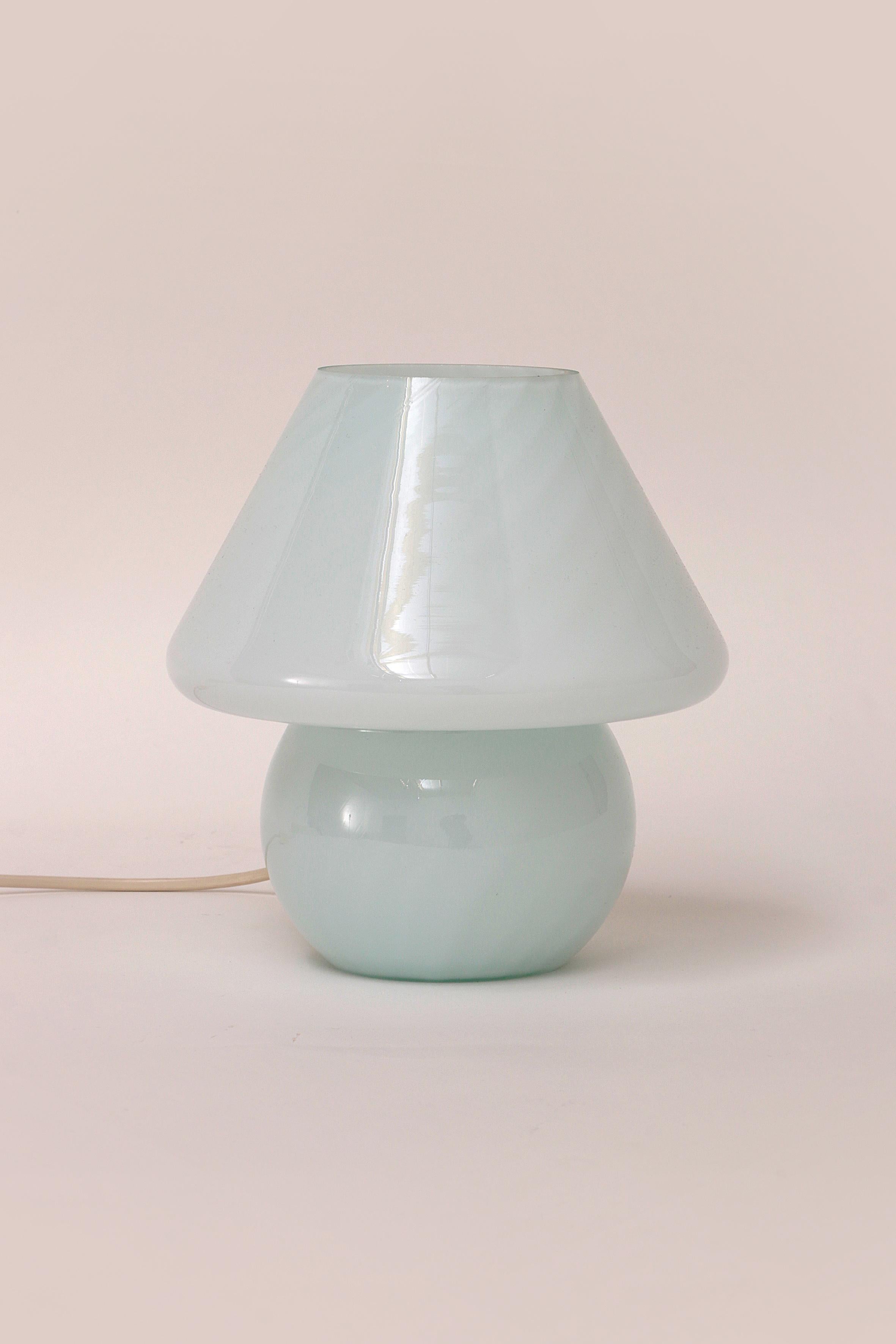 Beautiful mushroom lamp with a beautiful light made by Glashutte Germany in the 1960s.

It is bright without dazzling. With a nice soft light and a switch.

And casts light on the ceiling through the opening, which also pleasantly illuminates