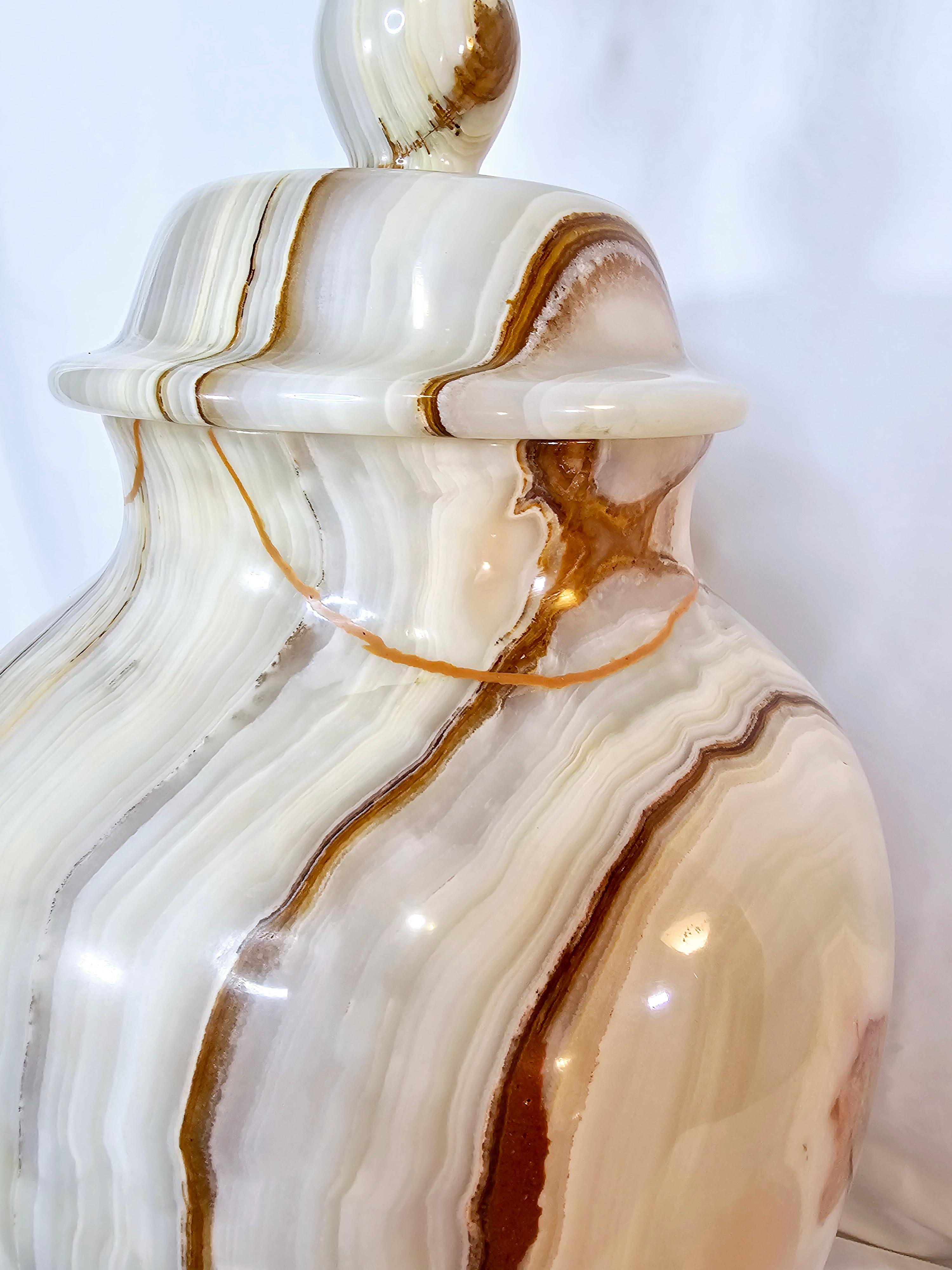 Gorgeous, vintage, heavy Hollywood regency white onyx lamp.
Carved out of a single piece of onyx.
Looks different from every angle. 
Heavily detailed brass base.
Like a piece of jewelry for a table.
Original cord and finial.
Adds some richness and