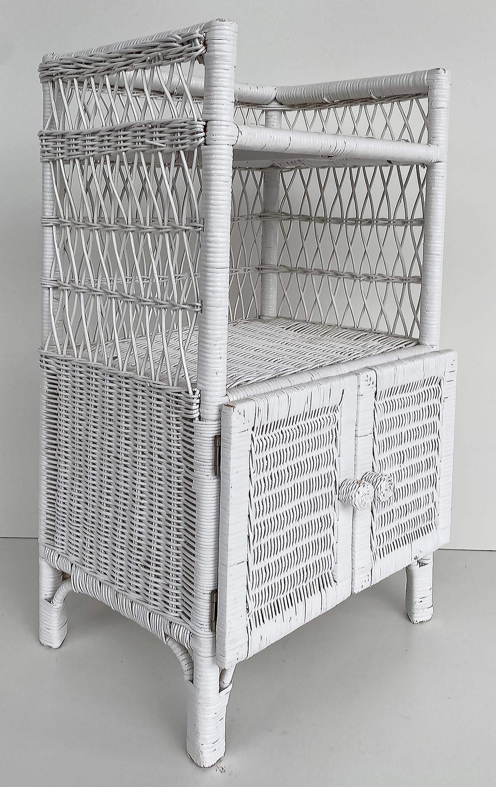 Vintage White-painted Coastal Rattan Night Stand or Side Table with Two Doors

Offered for sale is a vintage small cabinet that is perfect as a nightstand in a Coastal tropical bedroom or even as a storage cabinet in a bathroom.
