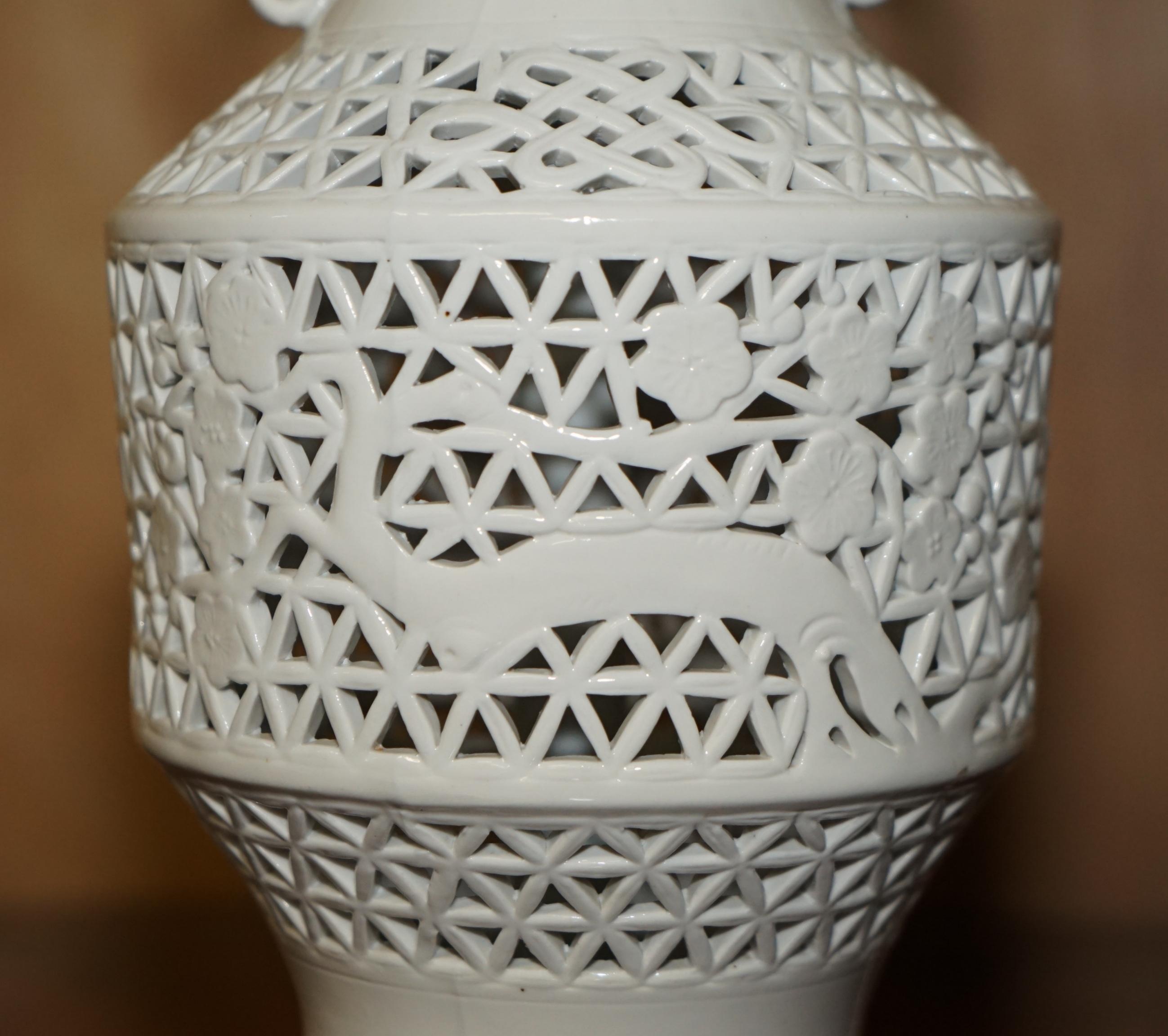 Hand-Crafted VINTAGE WHITE PORCELAIN CHiNESE STYLE LAMP WITH ORNATELY PIERCED BODY For Sale