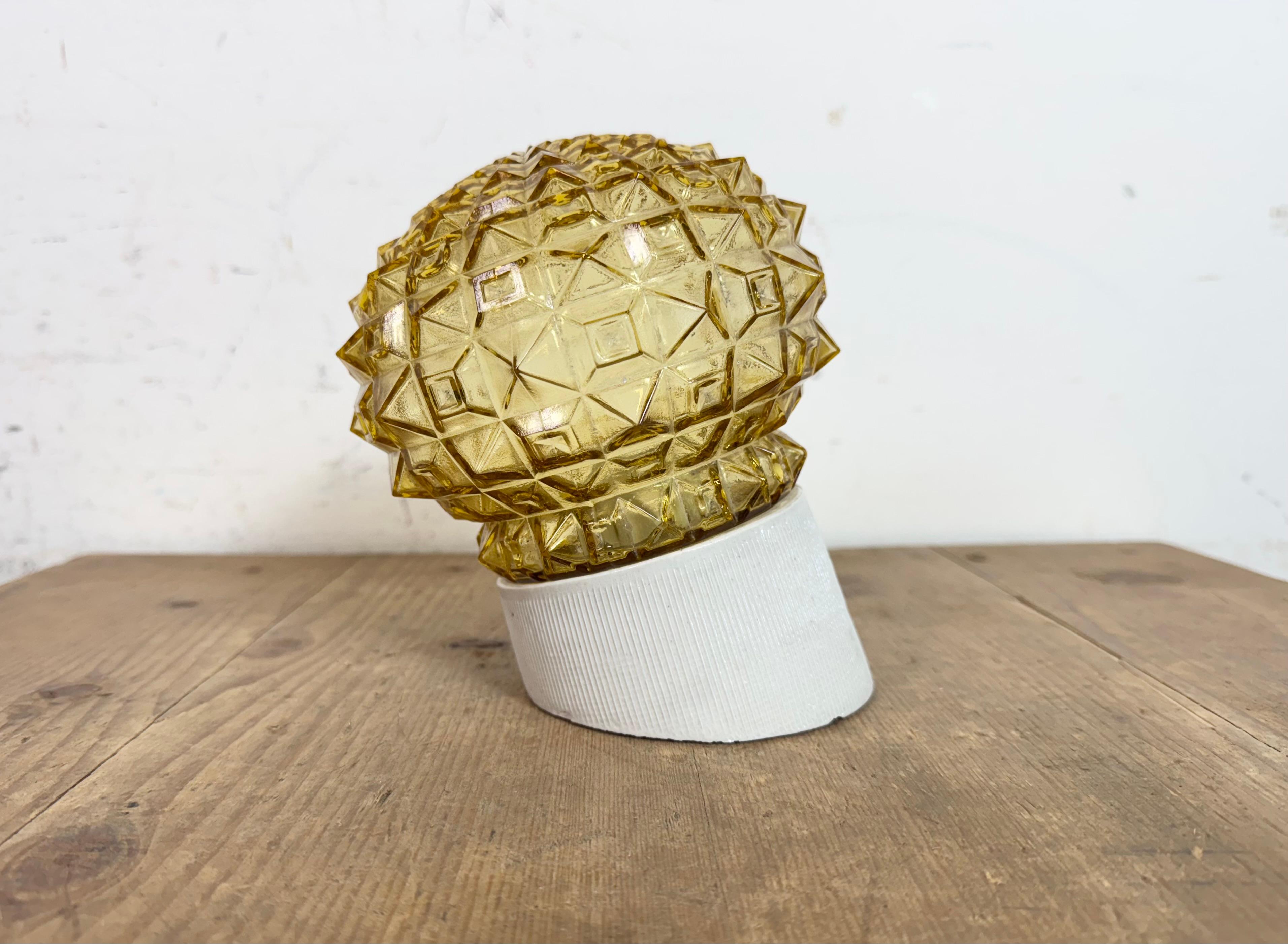 Vintage industrial light made in former Czechoslovakia the 1970s. It features a white porcelain wall mounting and a glass cover. The socket requires standard E27/E 26 light bulbs. New wire. The weight of the lamp is 1 kg.
Dimensions: 
Diameter of