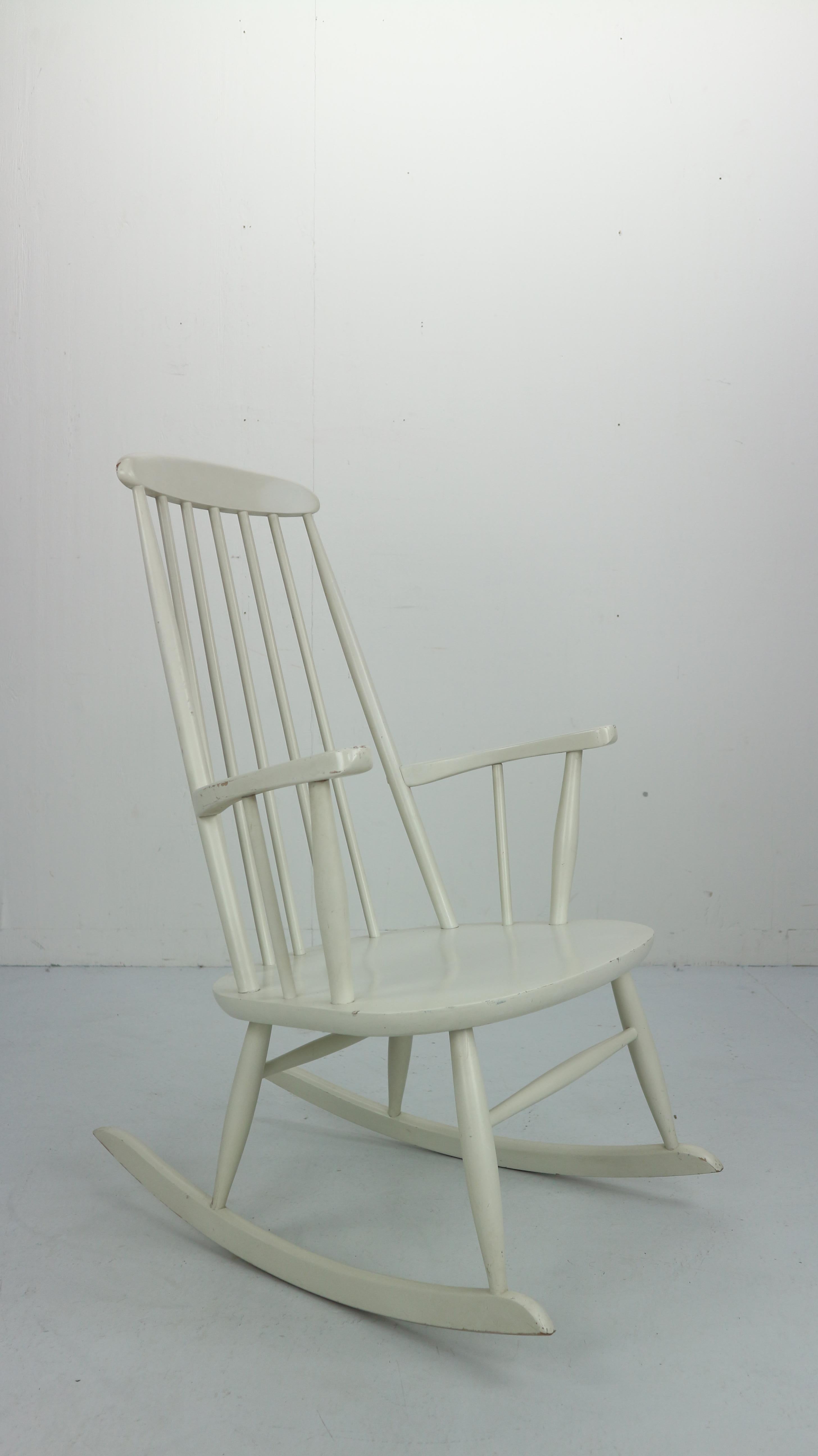 Classical Scandinavian design model of rocking chairs from the 1960s.
Wooden frame has been painted in a white colour.
Very beautiful and elegant design, very comfortable chair to relax.