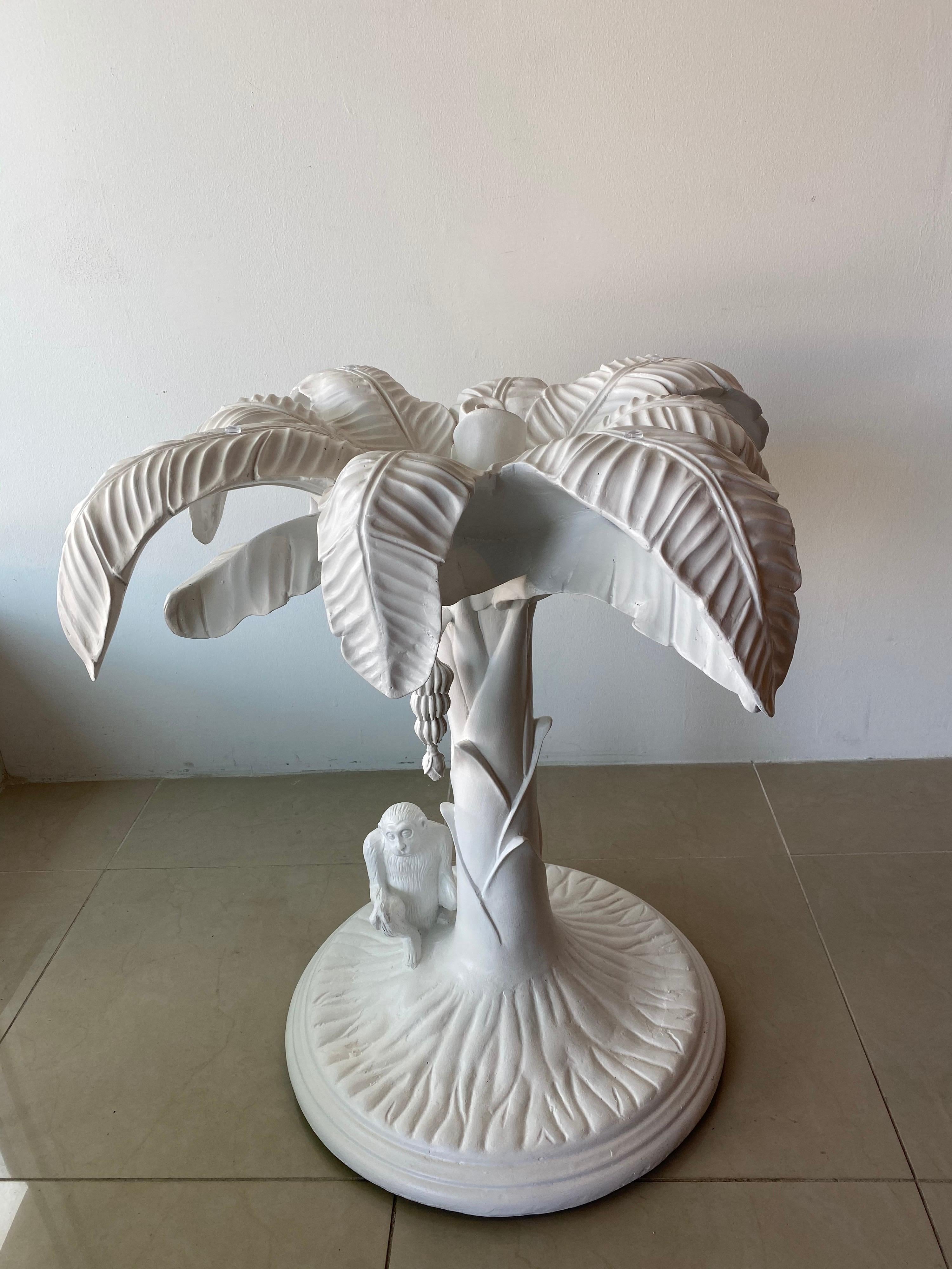 Lovely vintage palm tree with monkey and hanging bananas white table. This can be used as a dining table, center or entry table. I’ve placed a 36” piece of glass on top for scale. You can use smaller or much larger. The base is heavy and steady.