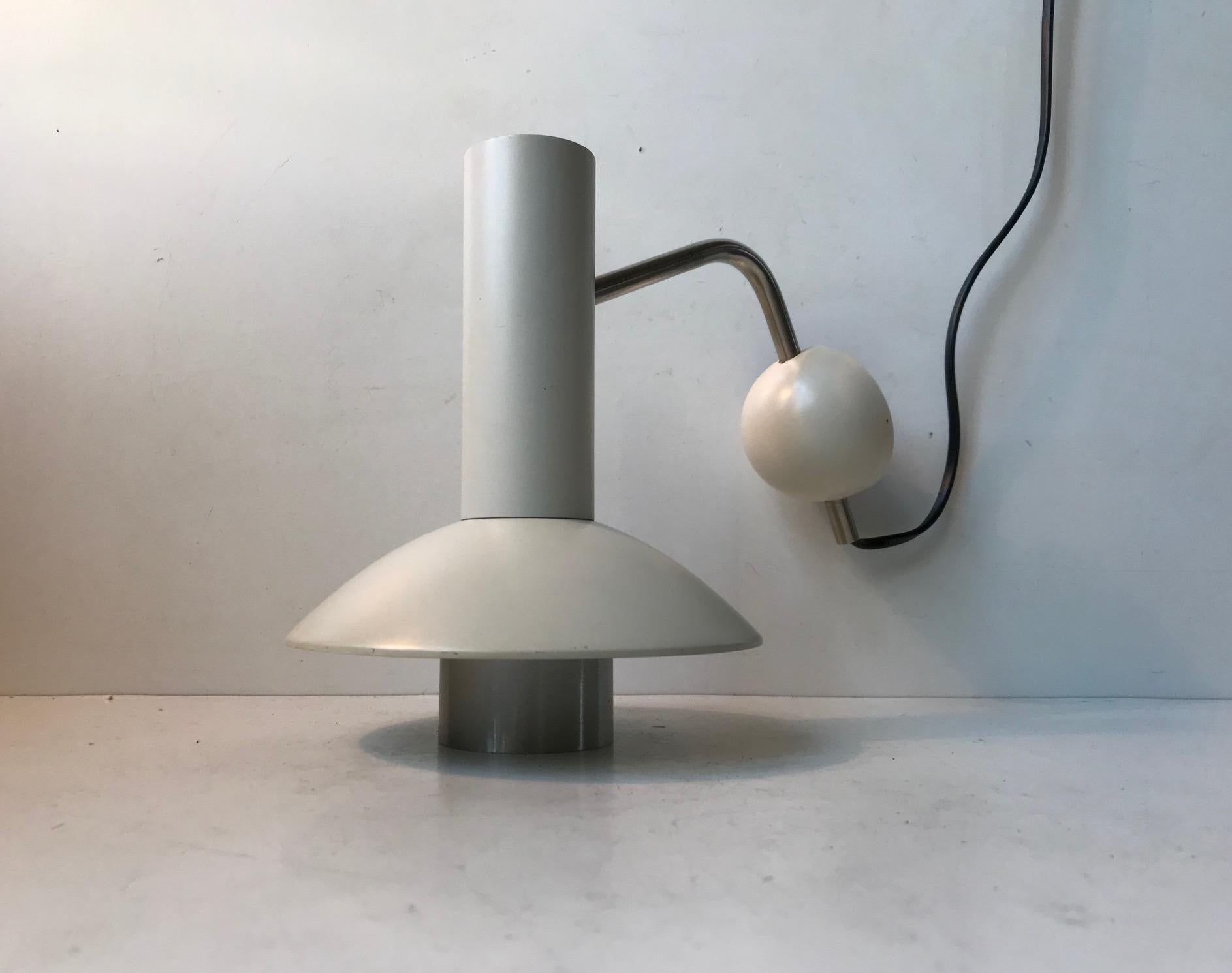 A rare white wall light designed and manufactured by Louis Poulsen in Denmark during the 1970s. This model - 132051 is called 'Louise' and is obviously derived from Louis in Louis Poulsen. Its fully adjustable - up/down and side to side at the