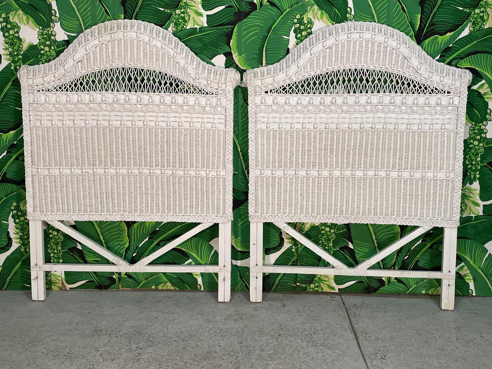 Pair of twin size wicker headboards feature intricate web work of both wicker and flat rattan reed along with wood bead accents. Very good condition with only minor imperfections consistent with age (see photos).
 
 