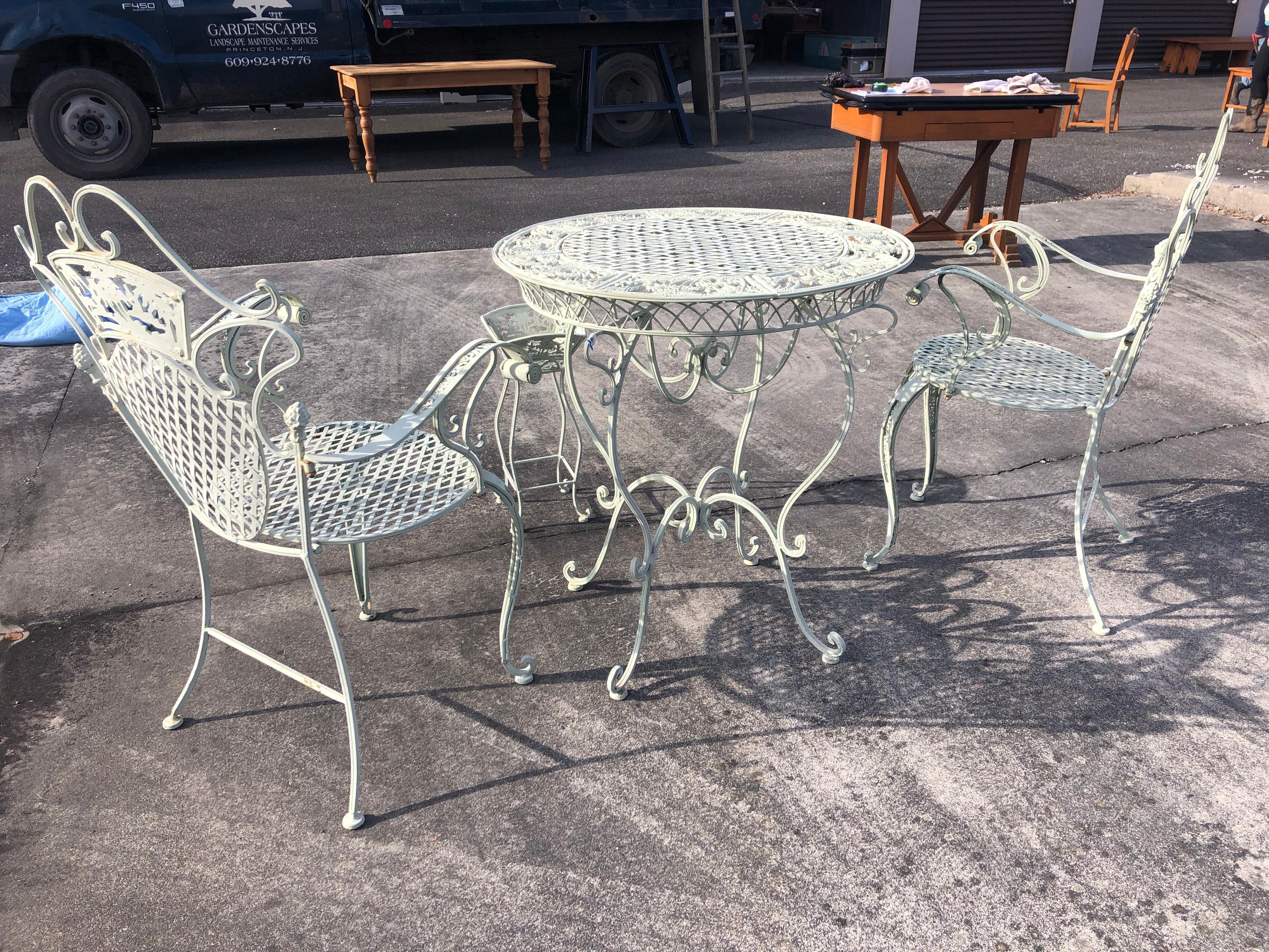vintage white wrought iron table and chairs