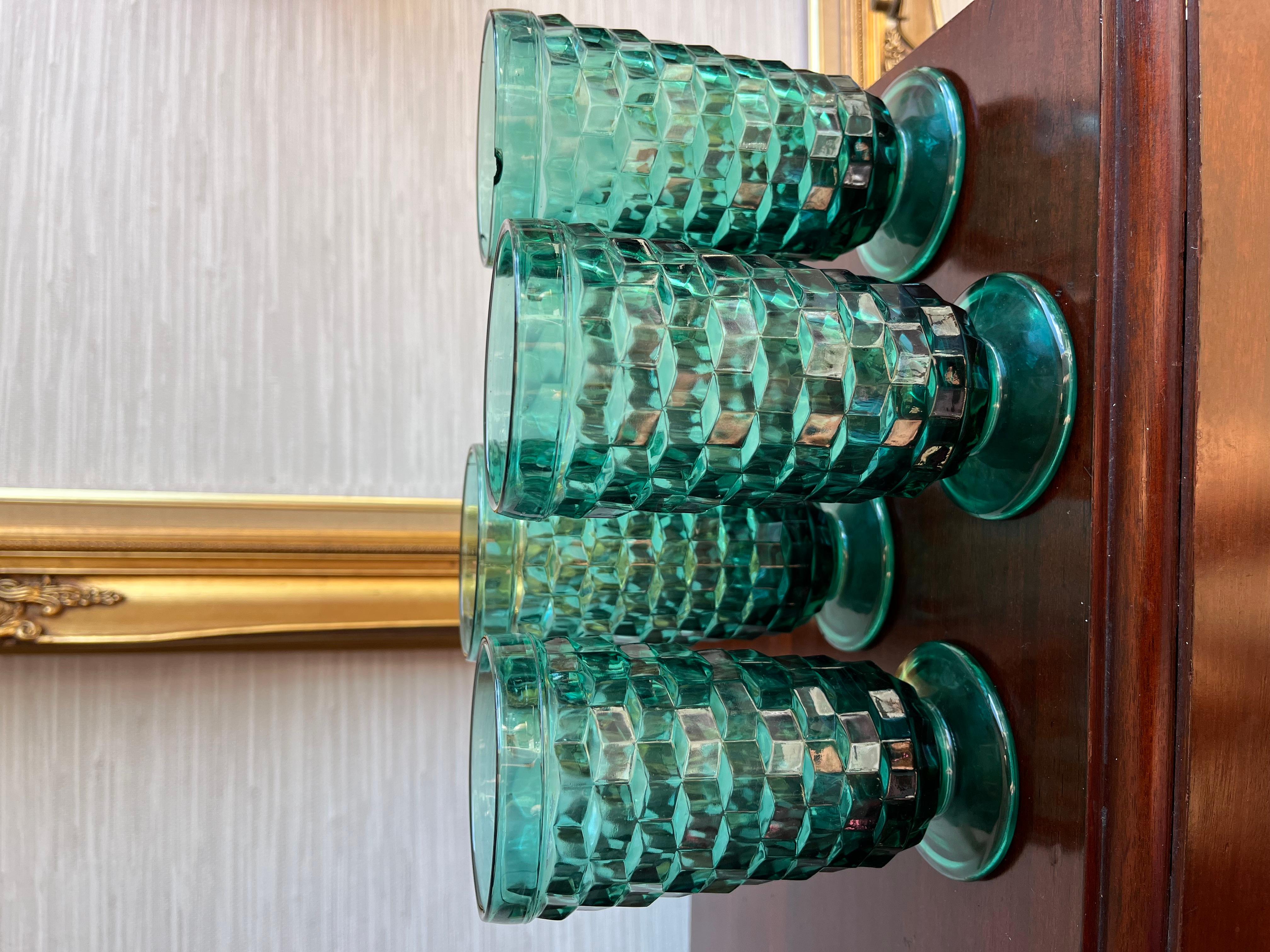 A set of four festive cubist Vintage Whitehall Teal Green Footed Ice Tea by Colony are perfect for the cocktail of your choice or iced tea.

Height: 6.25