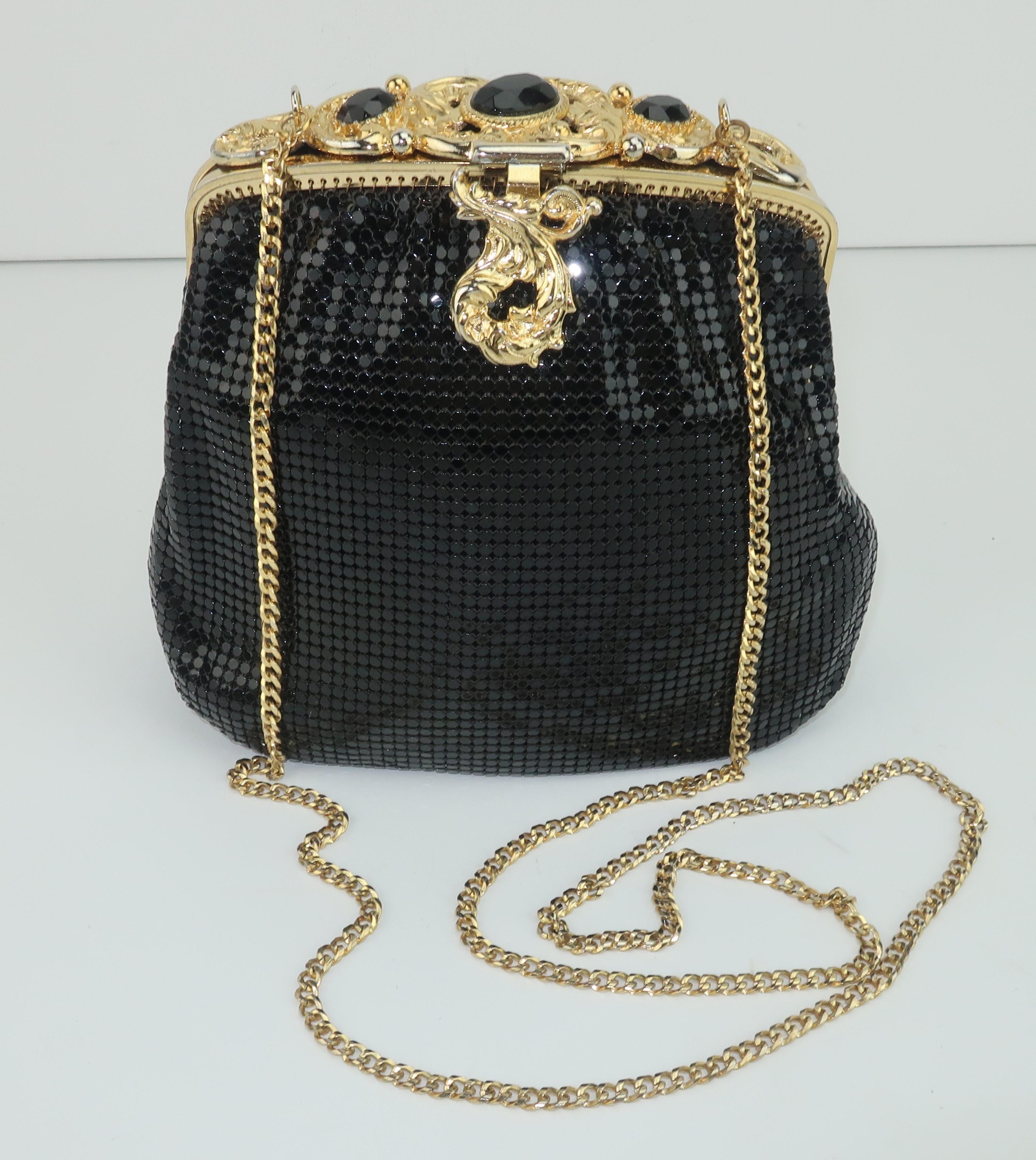 This classic Whiting & Davis black chain mail mesh handbag will take you from deco to disco!  Whiting & Davis has been producing fashionable handbags since the late 1800’s and their mesh designs represent classic American glamour.  The ornate gold