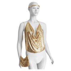 Vintage Whiting
Davis Gold Mesh Halter Top, Evening Bag and Headband 3pc Set Vintage Whiting
Davis Gold Mesh Halter Top, Evening Bag and Headband 3pc Set