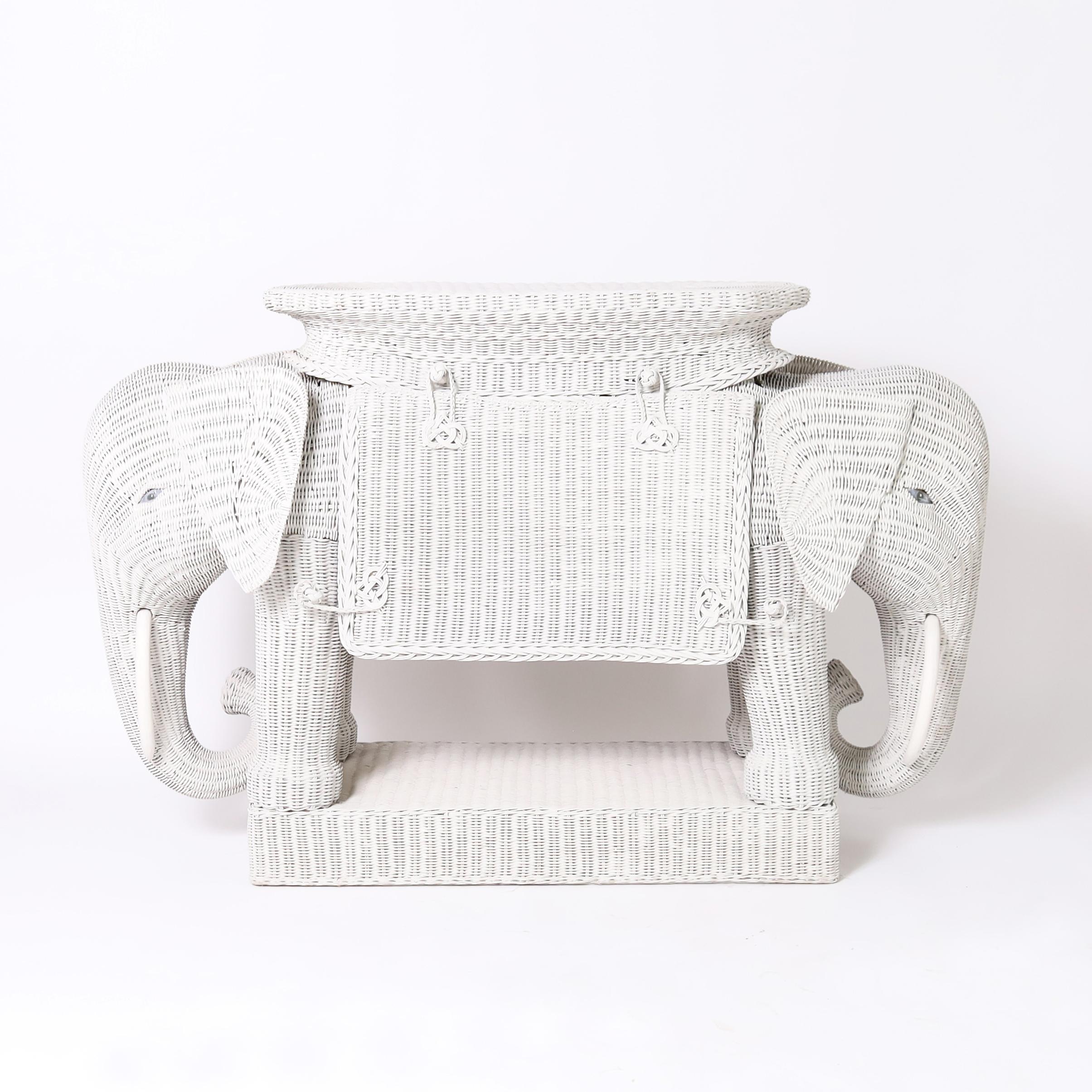 Mid Century Italian wicker serving bar handmade in stick wicker in a dramatic whimsical two headed elephant form with a chic milk paint finish and plenty of storage. 