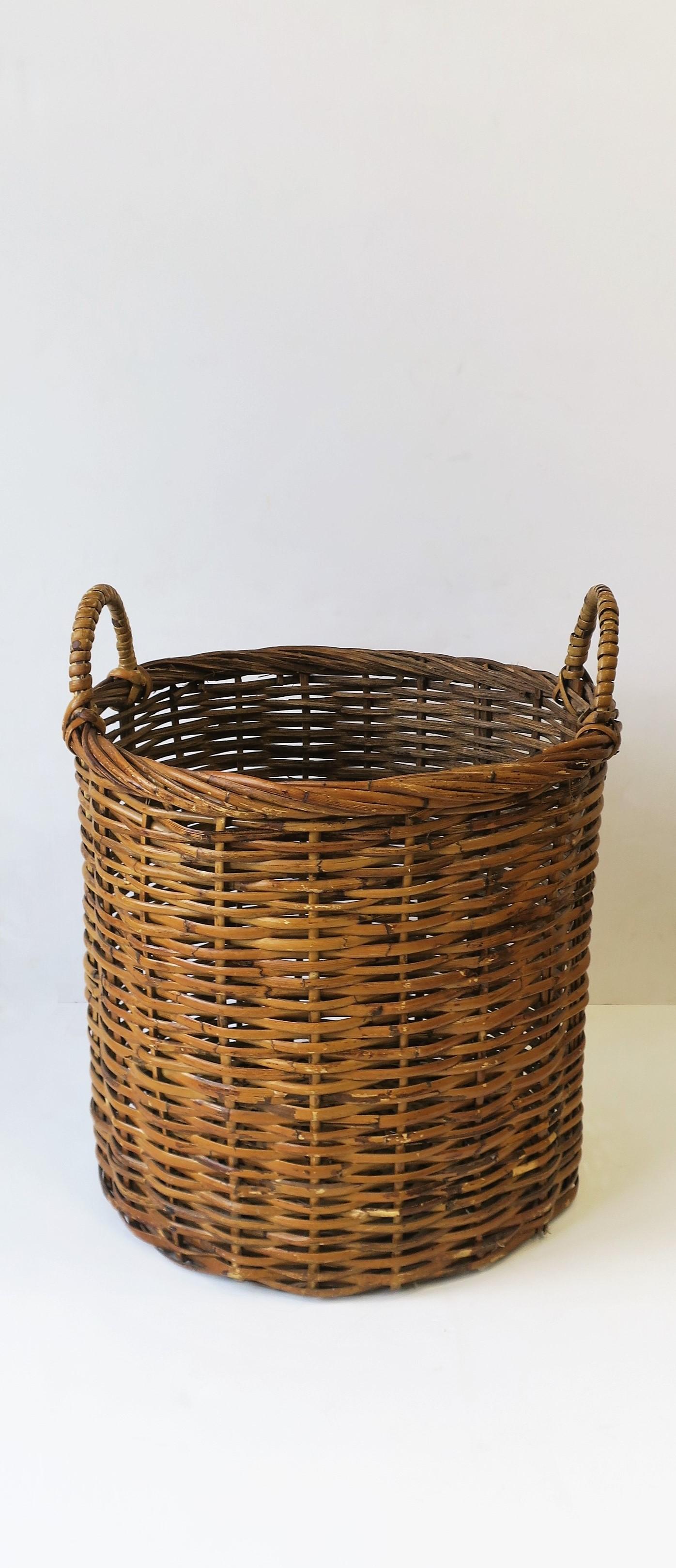 A relatively large, vintage wicker basket with handles, circa 20th century. Measures: 17