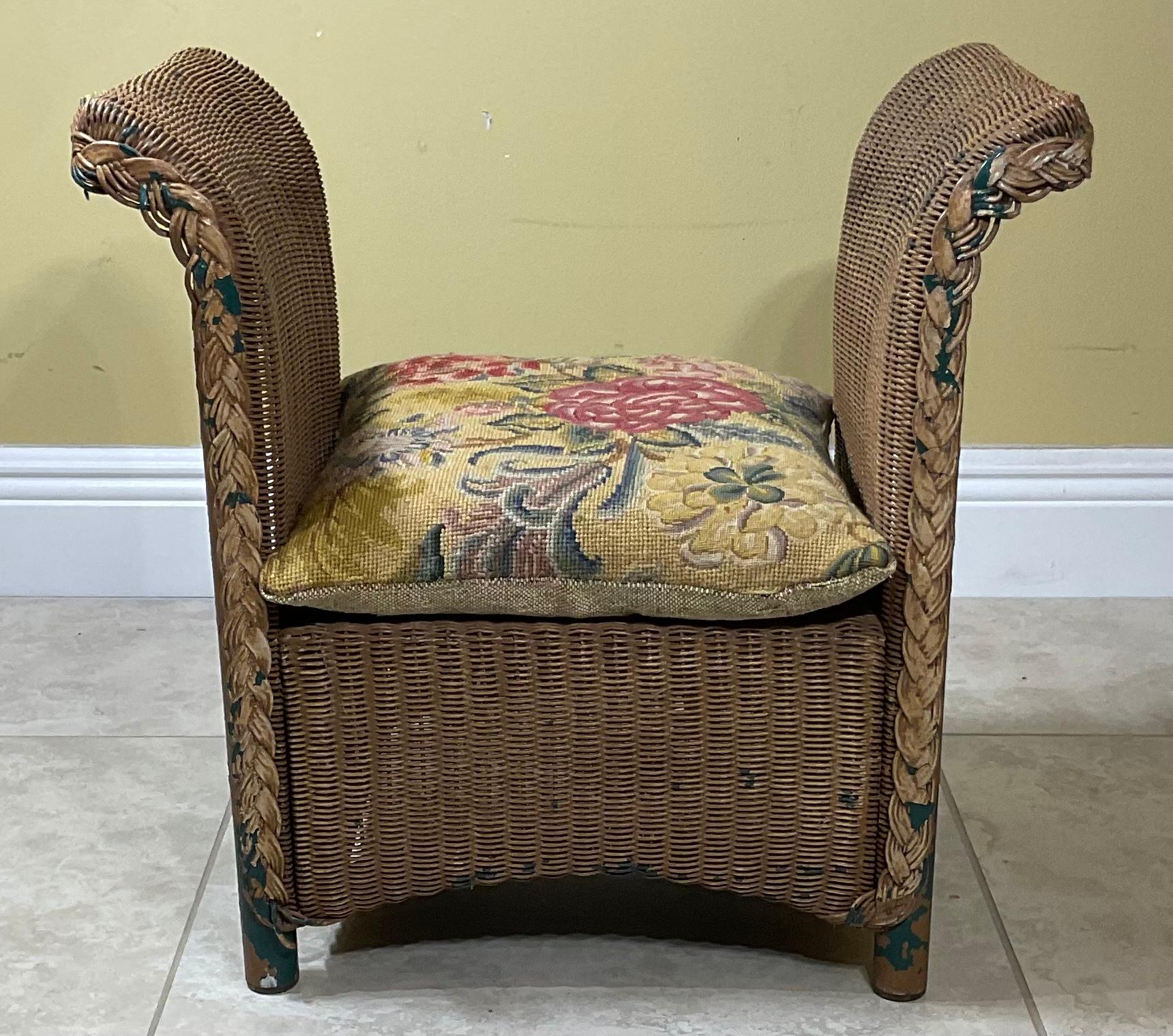 Funky child armchair and pillow crafted in wicker or reed with braided front pattern, all with solid piping support
Beautiful vintage needlepoint pillow is included.
    
