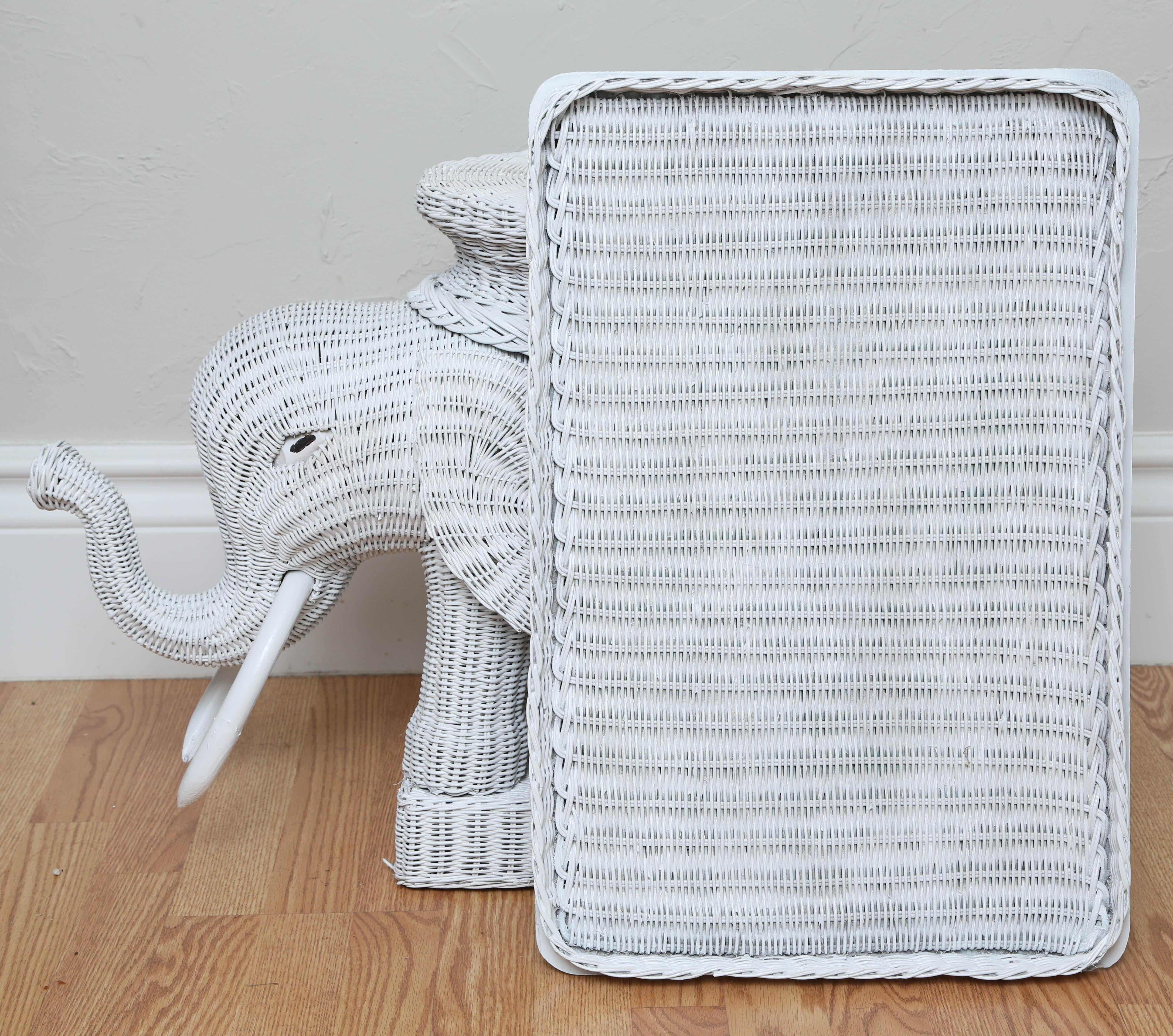 Whimsical wicker elephant side table with removable tray top.