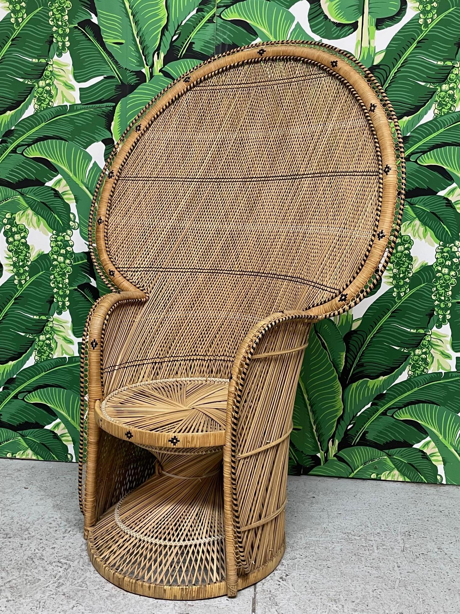 Vintage wicker peacock chair features a fine cross-weave pattern and intricate black rattan detailing. Twisted design base and large fan back. Very good condition with only minor imperfections consistent with age.

 