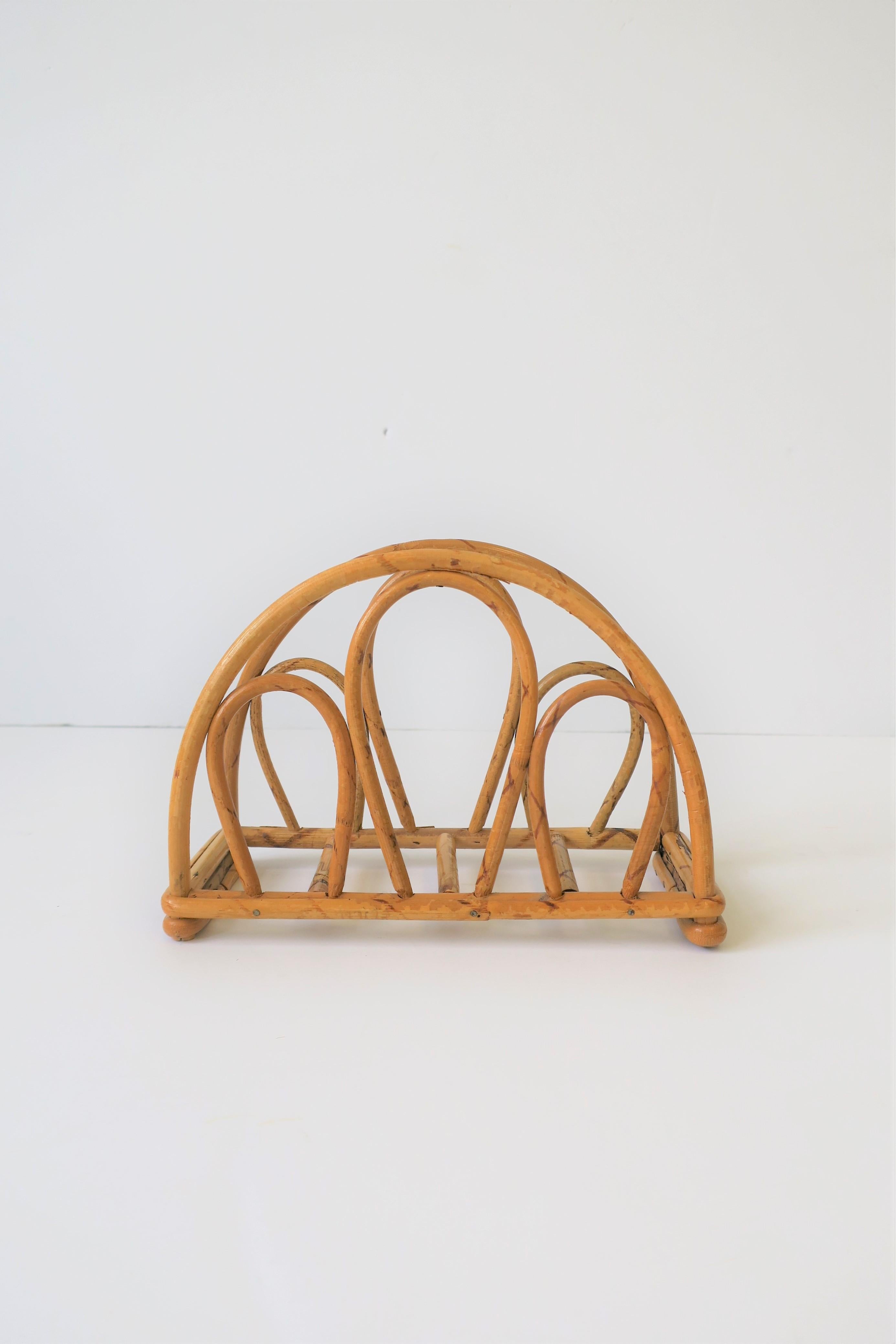 A beautiful vintage hand-crafted bentwood wicker rattan napkin holder, circa 1970s. 




 