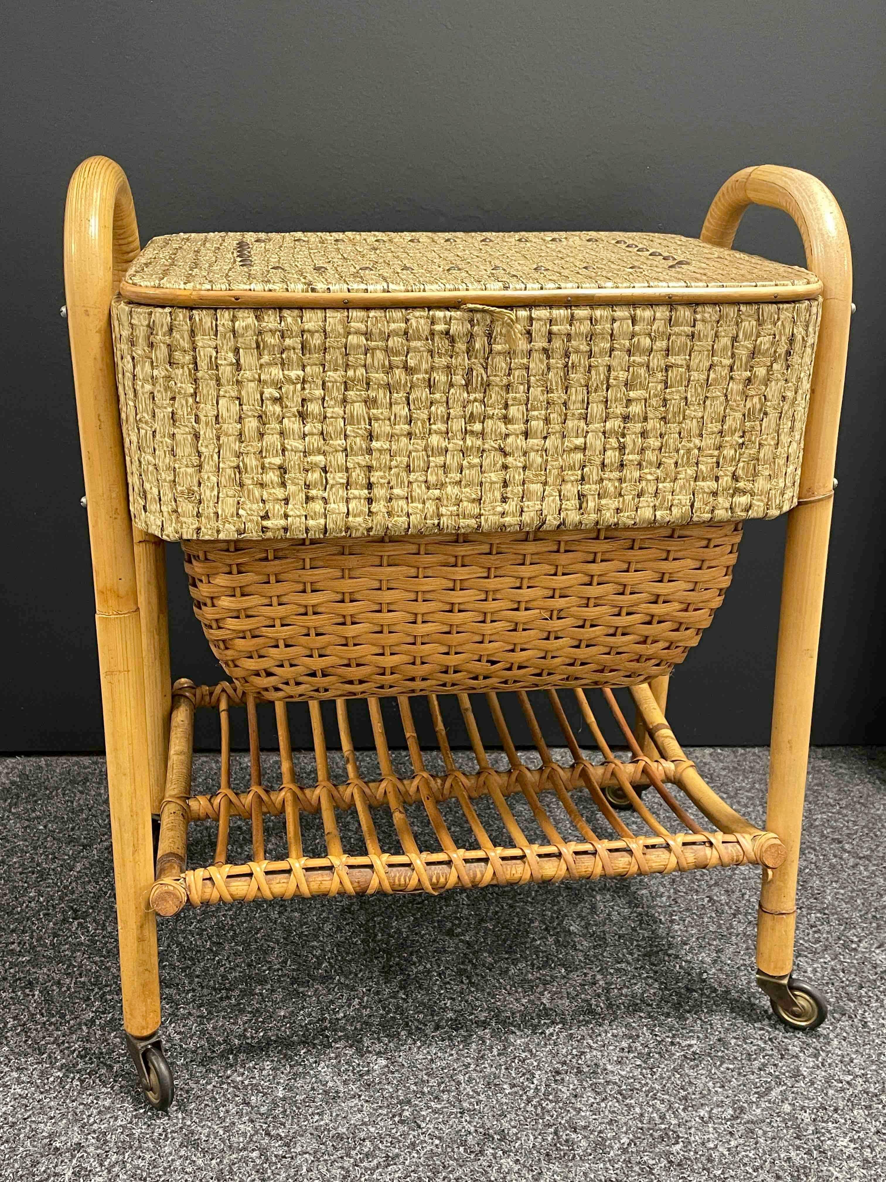 Beautiful rattan bamboo sewing box on wheels. This time capsule piece is in outstanding original condition. Don't smells - that’s a miracle! Made of Rattan, box made of wood and bamboo or rattan covered with plastic. The sewing box itself is approx.