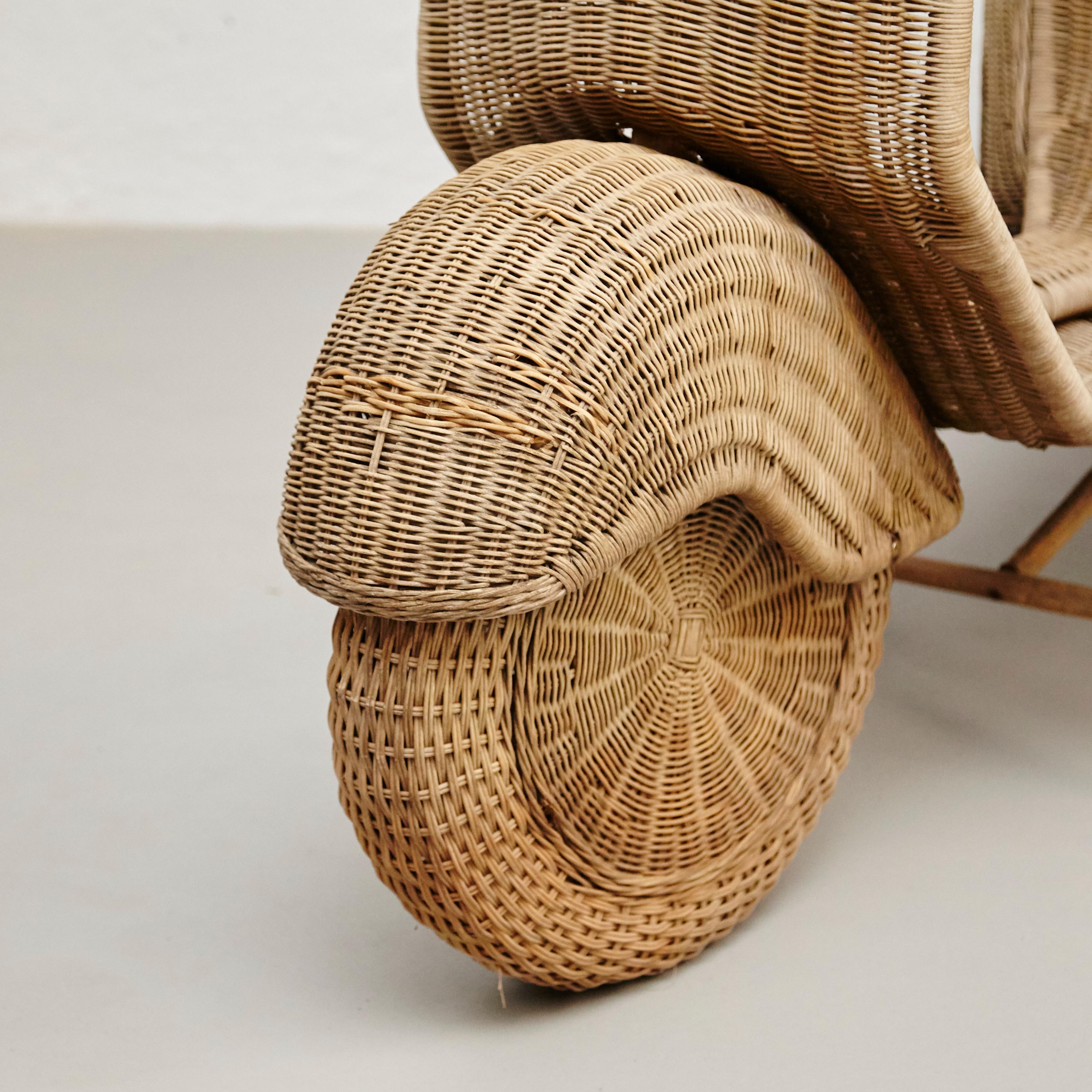 Vintage wicker rattan Vespa real size.
By unknown artisan, Spain, circa 1970.
In original condition, with minor wear consistent with age and use, preserving a beautiful patina.

Materials:
Rattan

Dimensions:
D 160 cm x W 69 cm x H 94 cm.