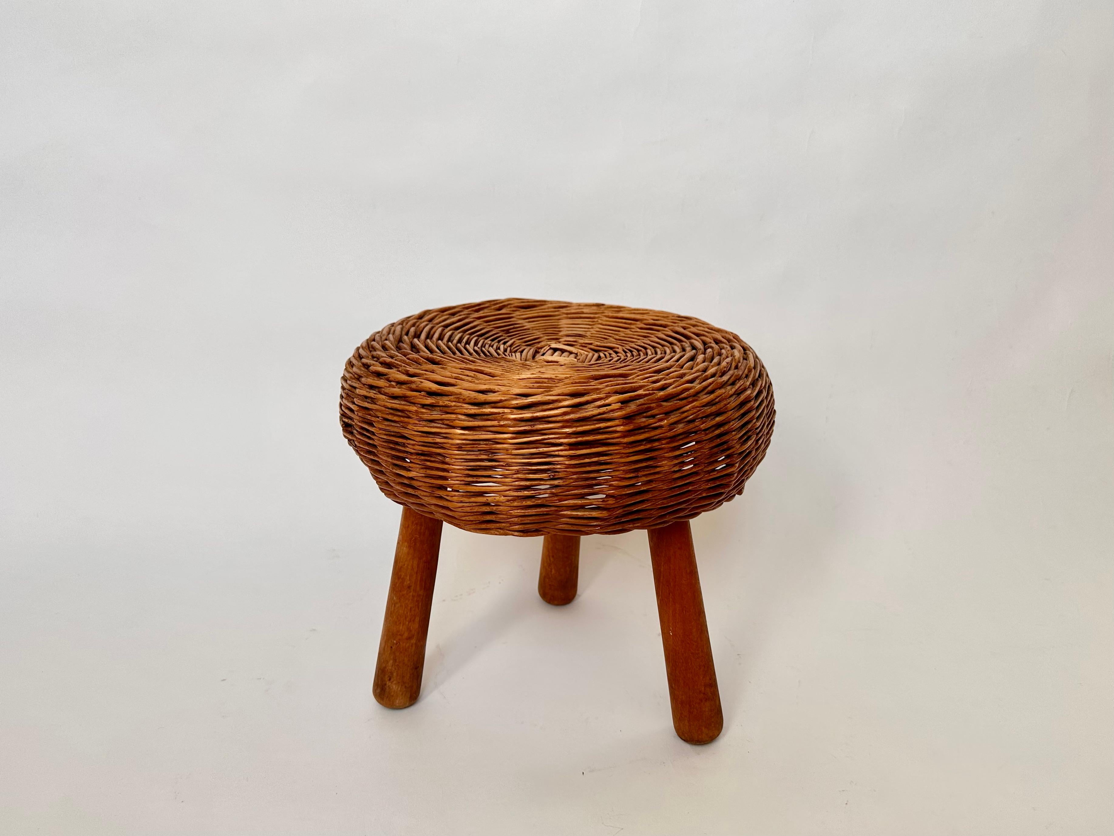 Small vintage tripod stool in the manner of Tony Paul, circa 1950-60

Ideal for use as a low side table.

Woven wicker circular seat on beech legs. The stool has aged nicely and has a great colour.

No repairs or restoration, cleaned ready for