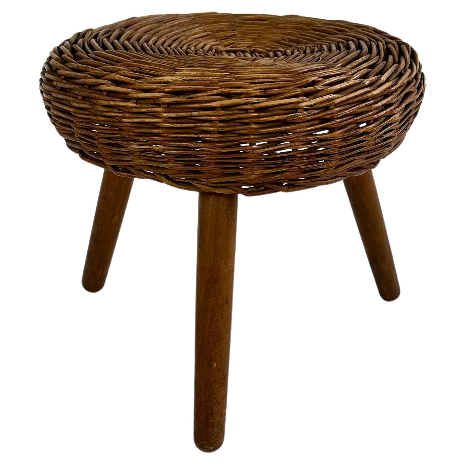 Vintage wicker tripod stool in the manner of Tony Paul For Sale