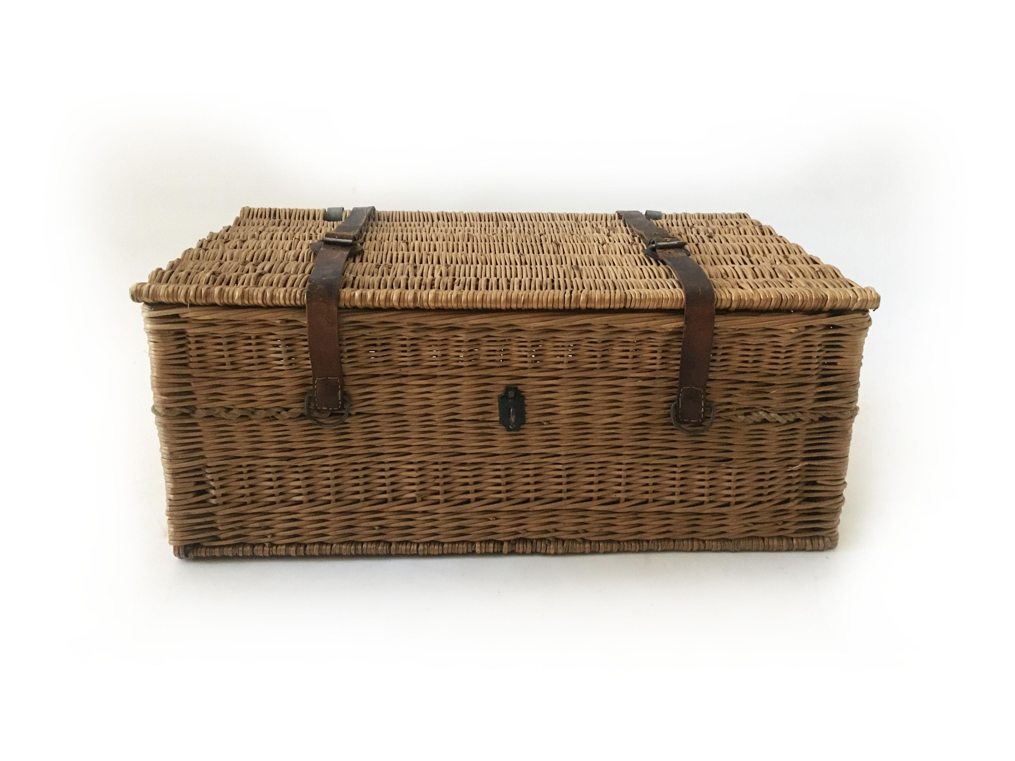 Vintage Wicker trunk, wine basket from Bordeaux, France, 1930s. Remarkable good condition, given the age and that it was used for years to transport wine bottles. Charming patina to the leather belts. Makes a lovely coffee table for a intimate
