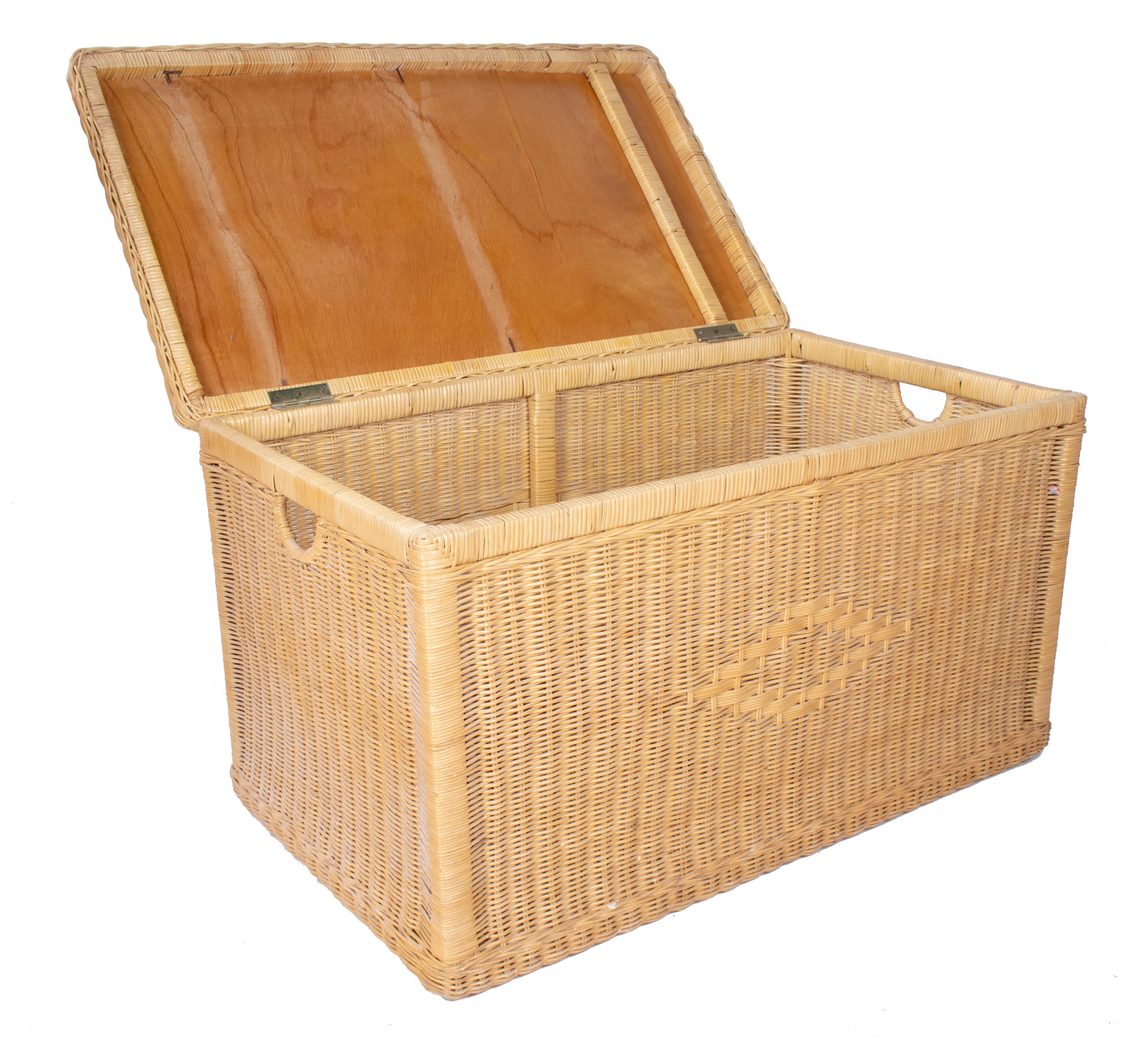 Vintage wicker trunk with wooden frame and lid.
