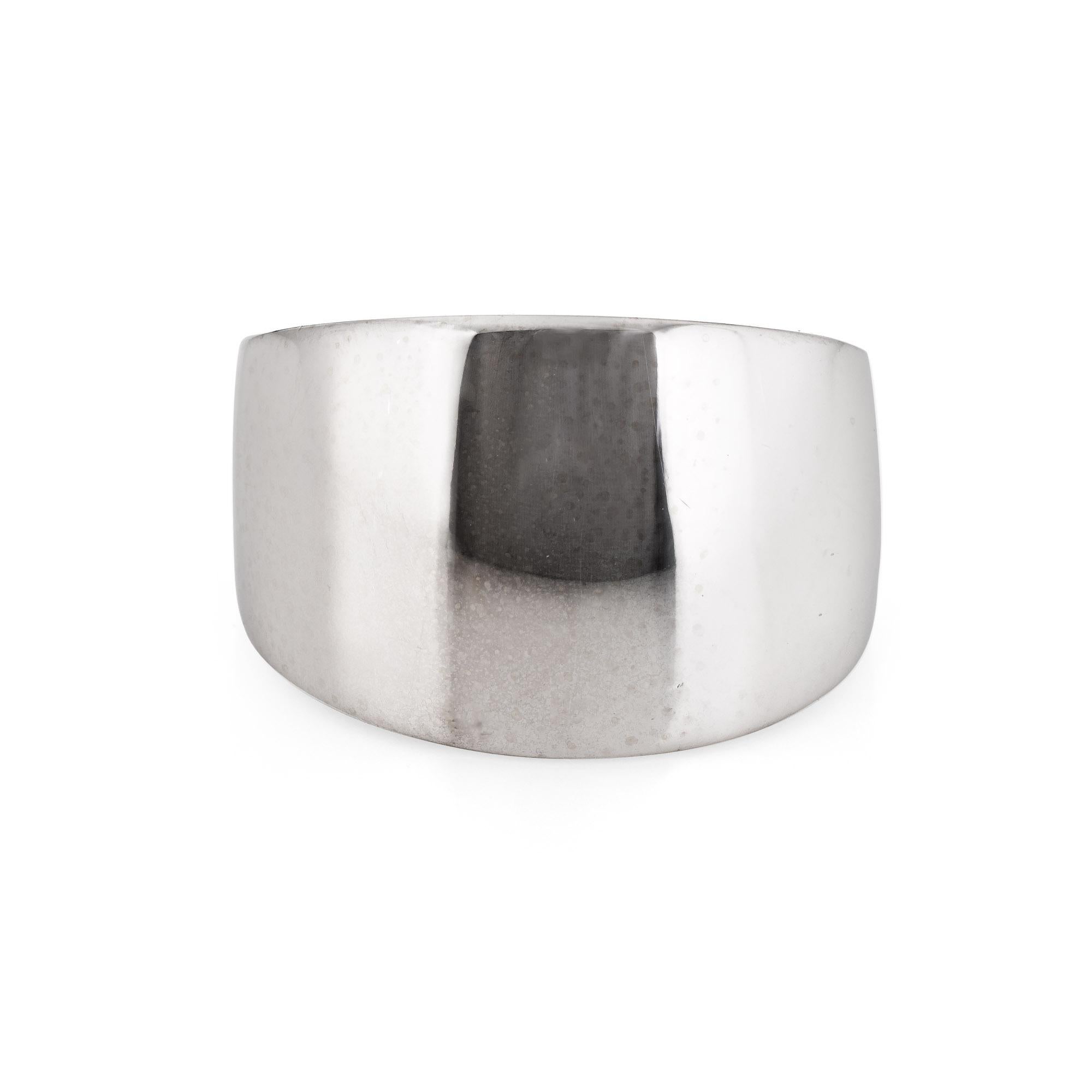 Stylish vintage wide band cigar ring crafted in 14 karat white gold. 

The band measures a wide 15mm (0.59 inches) and sits flat on the finger (rises 3mm from the finger). The ring is impactful in design and ideal worn day or night. 

The ring is in