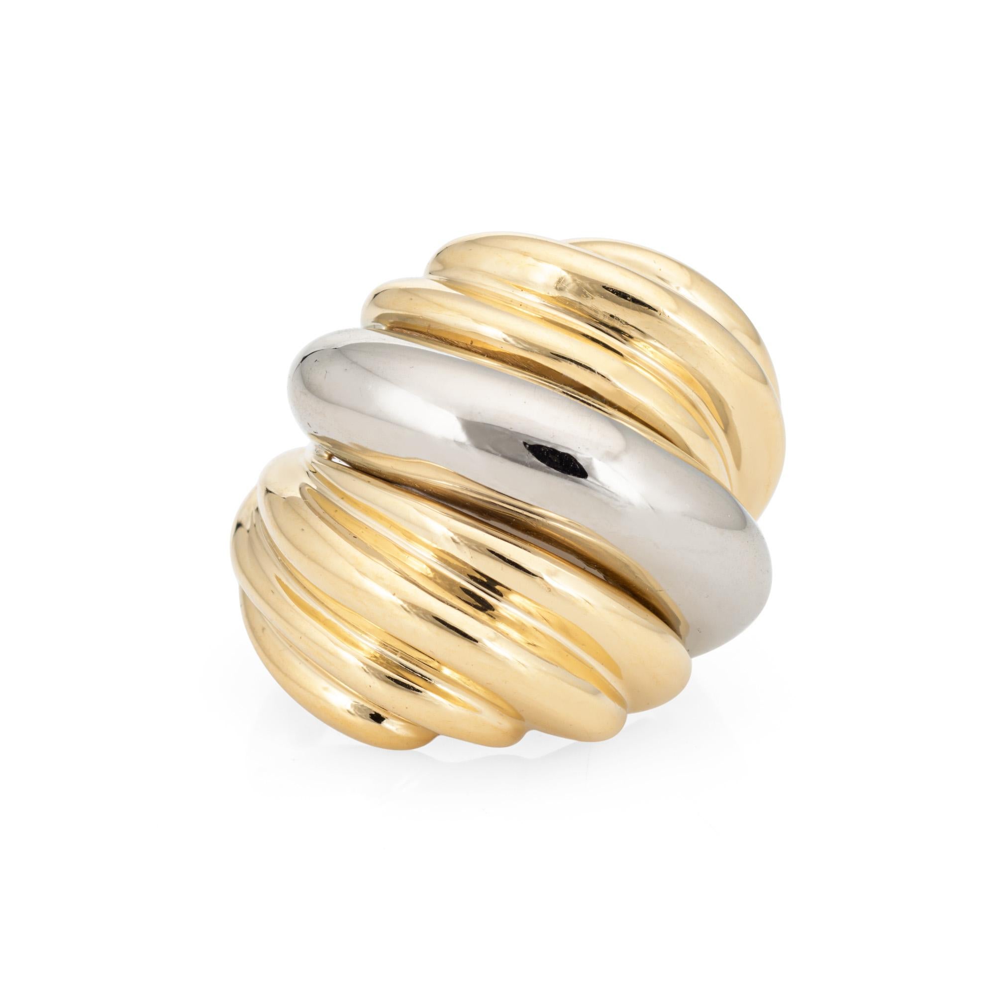 Stylish vintage 18k gold ribbed dome ring (circa 1980s) crafted in two-tone 18k yellow & white gold.

The beautifully crafted ring features a ribbed design in an off-set domed position. The ring has a weighty feel (16.1 grams) and makes a great