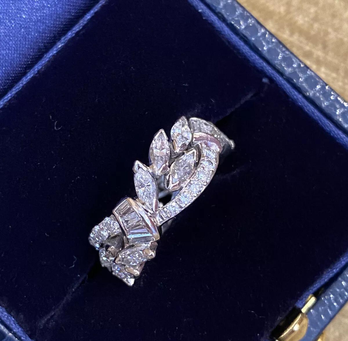 Vintage Wide Diamond Eternity Band 3.00 carat total weight in Platinum

Vintage Diamond Eternity Ring features Marquise, Round, and Baguette Diamonds totaling 3.00 carats Prong set and Bezel set in Platinum.

Ring size is 6.25 and 8mm wide.
The ring