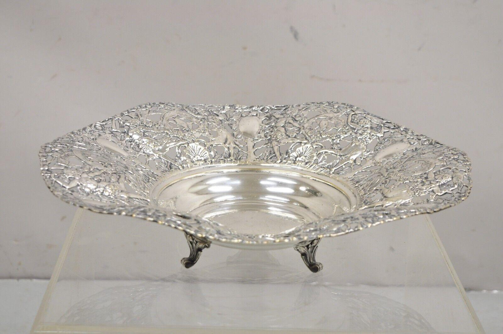 Vintage William Adams WA Spain Silver Plated Figural Repousse Large Footed Fruit Bowl. Item features Ornate females and birds throughout, pierced design, raised on feet, original hallmark, very nice vintage bowl. Circa Mid 20th Century.