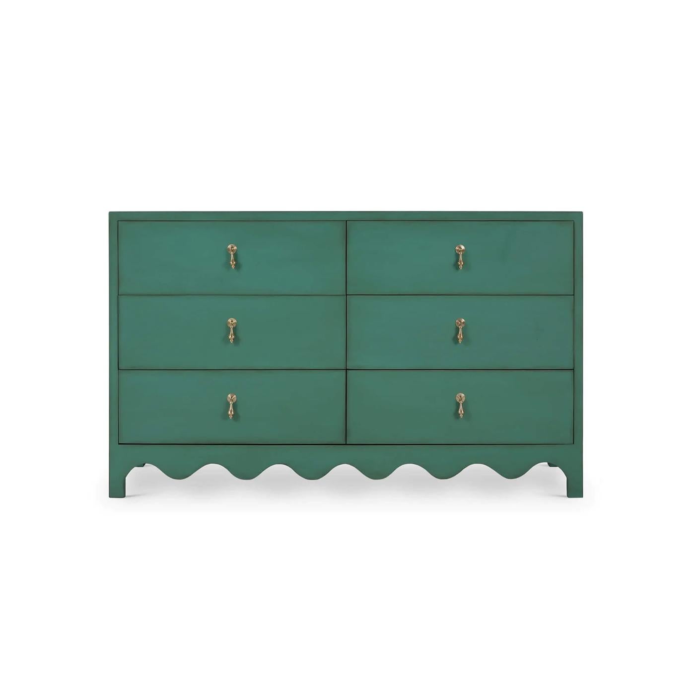 The deep vintage willow green hand-painted and lightly distressed finish beautifully complements various décor styles, from traditional to contemporary. With scalloped edge detailing along the base and elegant gold-tone drop pull handles, this