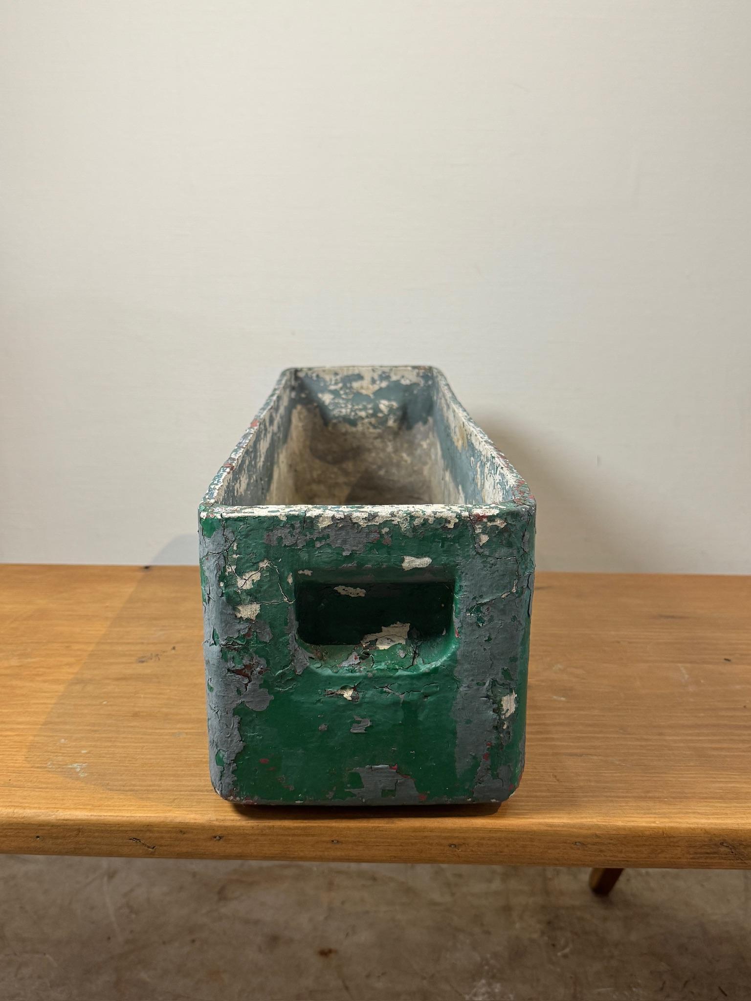 A rare and highly collectible vintage industrial planter box designed by Willy Guhl. This long rectangular planter features a heavily distressed green and white painted surface with a beautifully aged patina. Designed for durability and function,