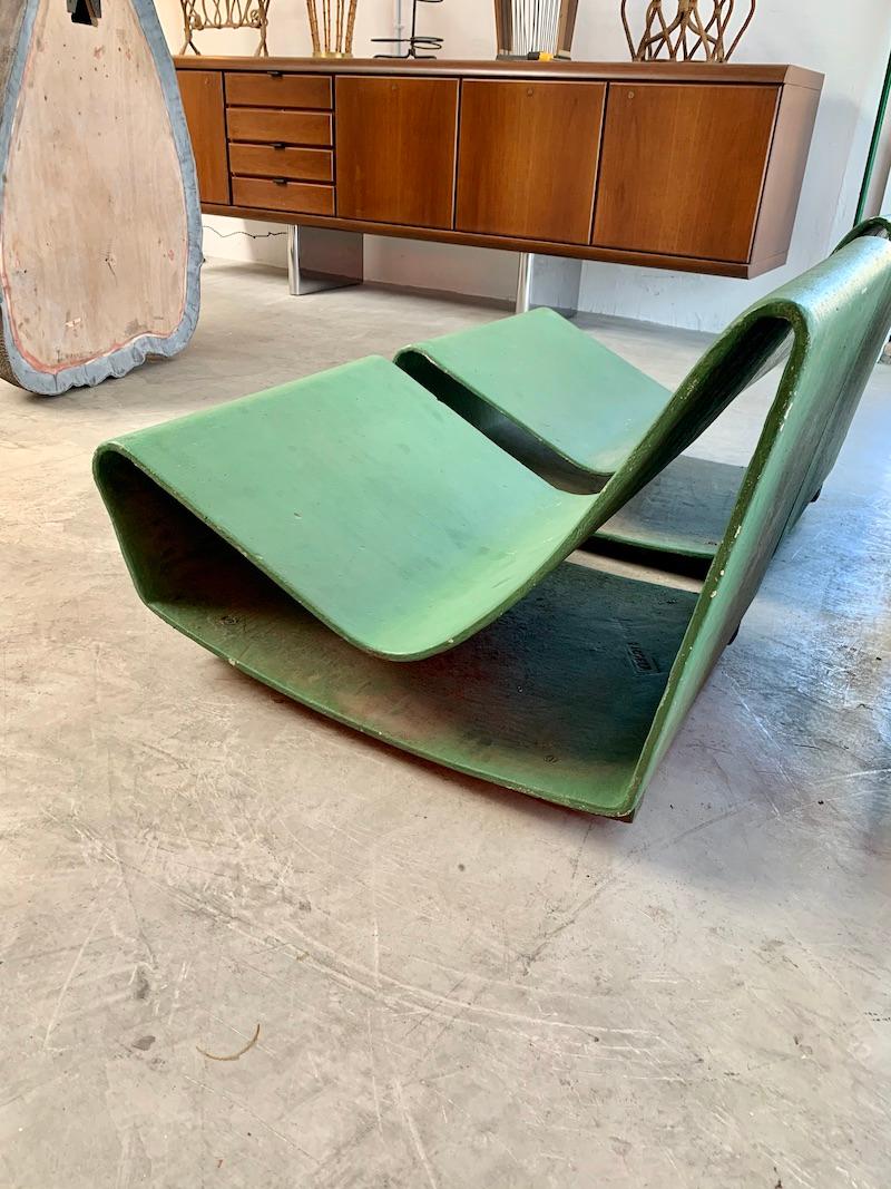 Rare set of vintage Willy Guhl Loop chairs from Rio de Janeiro, Brazil. These concrete chairs are getting increasingly difficult to find. Painted green years ago. Made in the early 1960s. The loop chairs from Brazil have a wood plinth base to