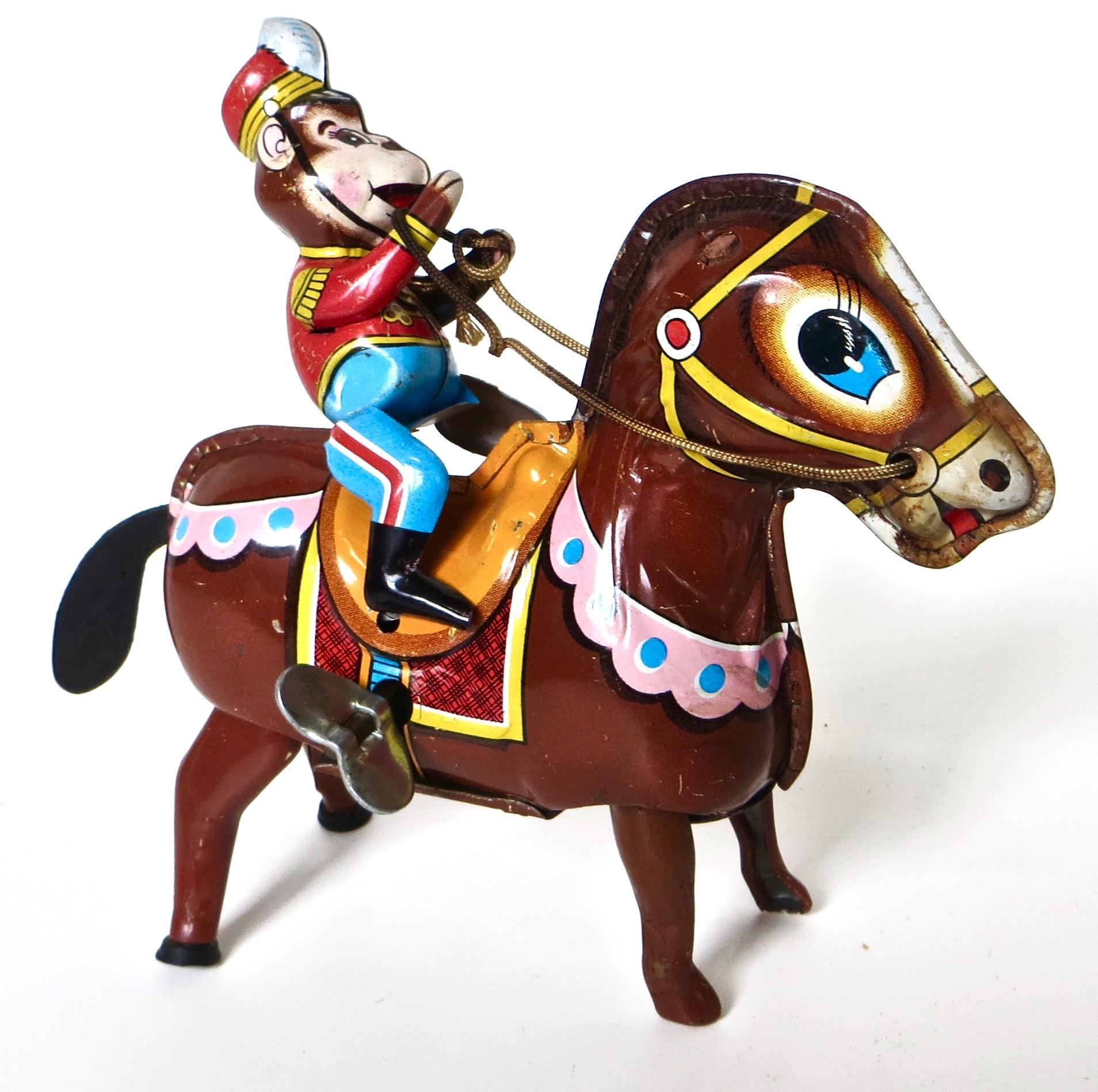 Made in Tokyo, Japan by The Haji Company (see image for mark/logo), this all tin vintage wind up toy, circa 1958, depicts a 