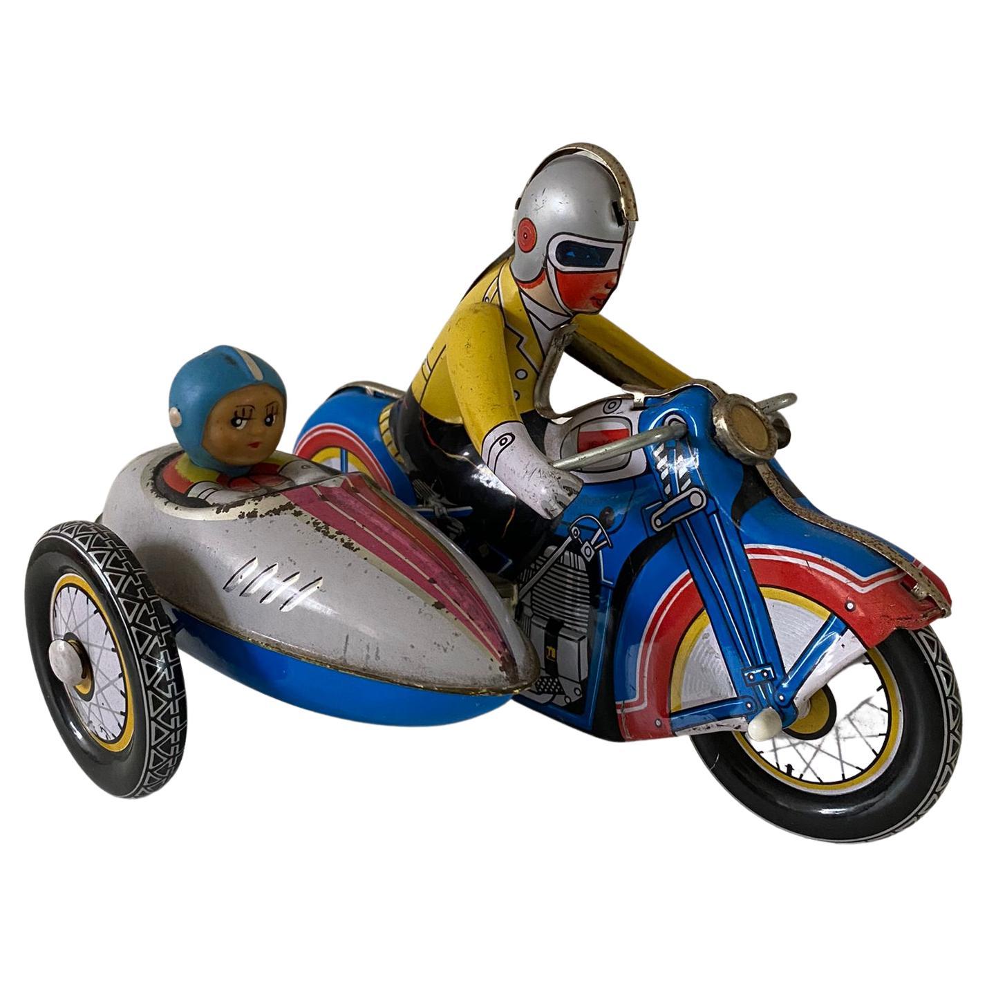 Vintage Wind-Up Tin Toy Motorcycle with Co-Driver and Key For Sale