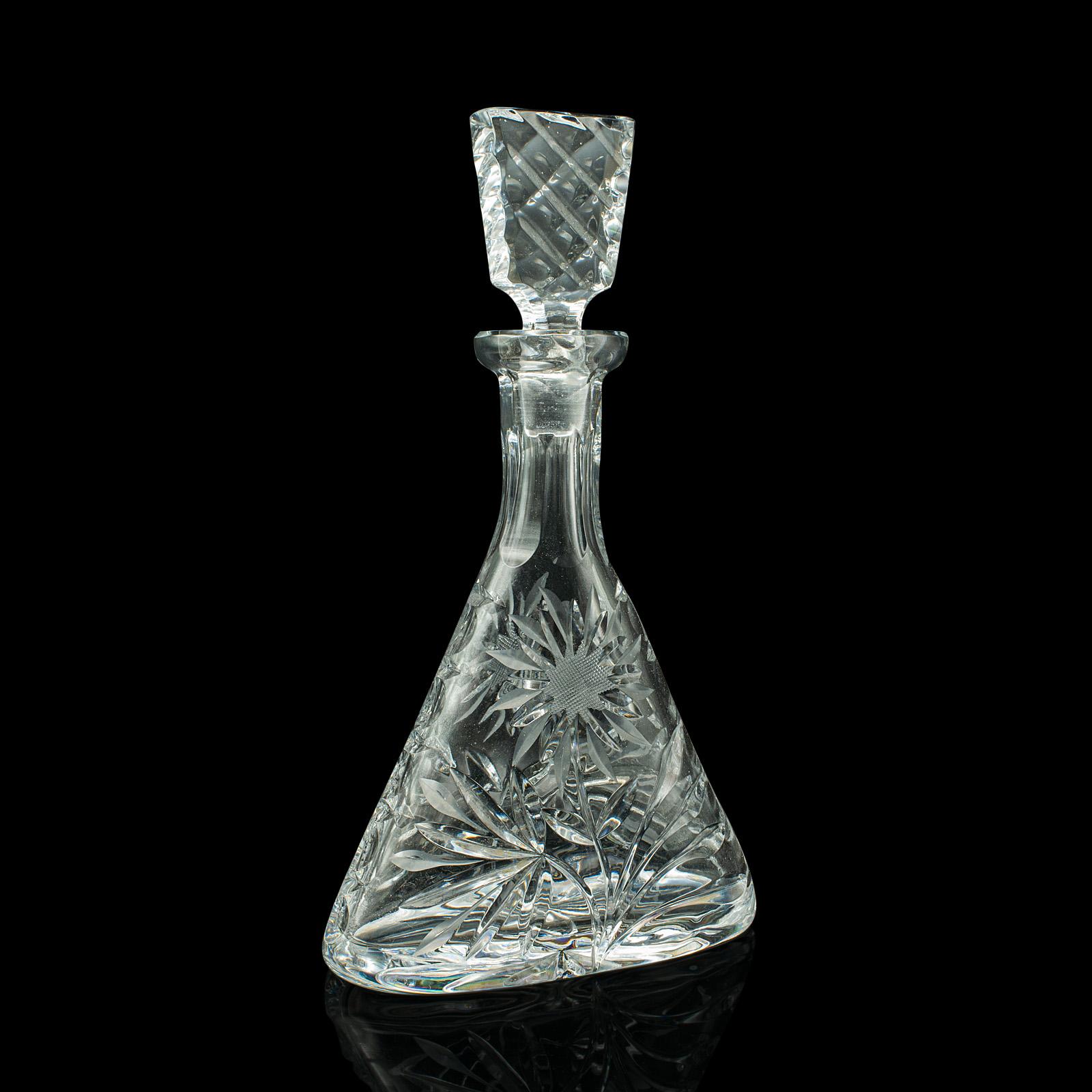 This is a vintage wine decanter. An English, cut glass spirit vessel, dating to the mid 20th century, circa 1960.

Superb decanter, with a great decorative appearance
Displays a desirable aged patina and in good order
Quality cut glass accentuates