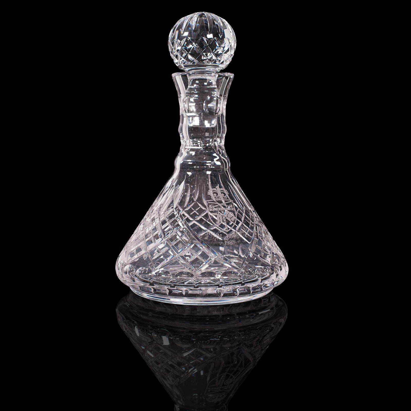 This is a vintage wine decanter. An English, glass conical vessel with golf interest, dating to the late 20th century.

From the 19th hole to your very own lounge
Displays a desirable aged patina
Clear, bright cut glass in good order
Detailed