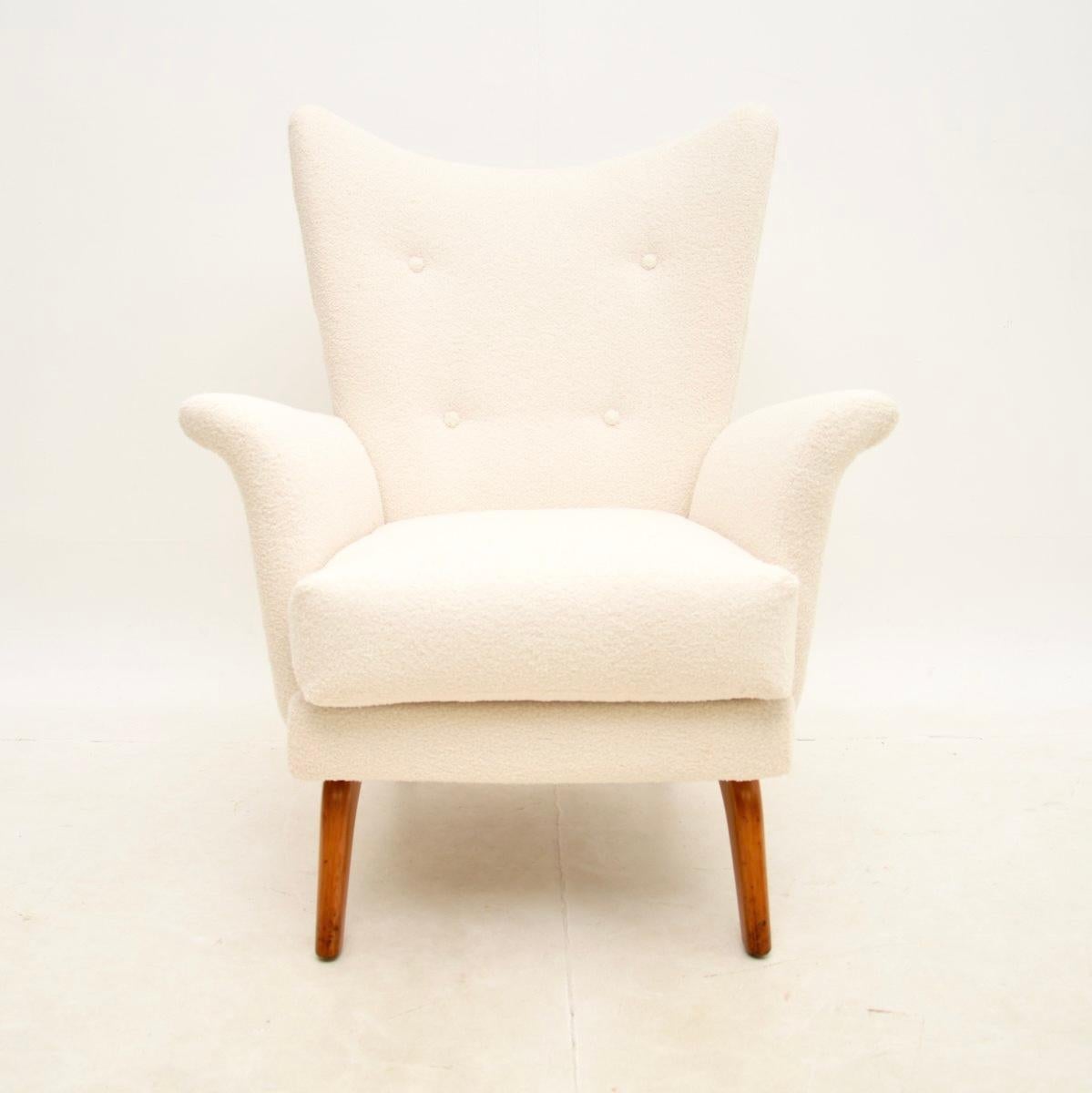 A very stylish and extremely comfortable vintage wing armchair by Howard Keith. This was made in England, it dates from the 1960’s.

It is of amazing quality and is a lovely size, quite small and compact yet offering a generous seating area.

We