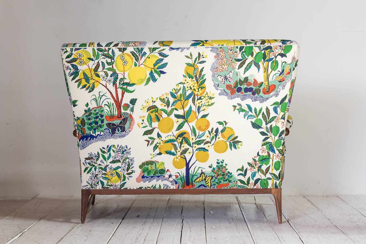 Mid-20th Century Vintage Wingback Settee Newly Upholstered in Colorful Josef Frank Fabric