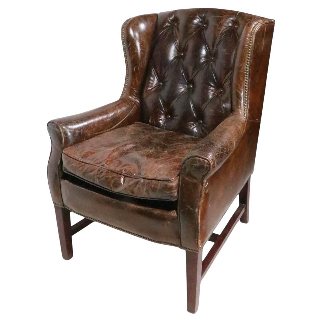 Vintage Wingback Chair in Patinated Brown Leather with Brass Nailhead Trim For Sale