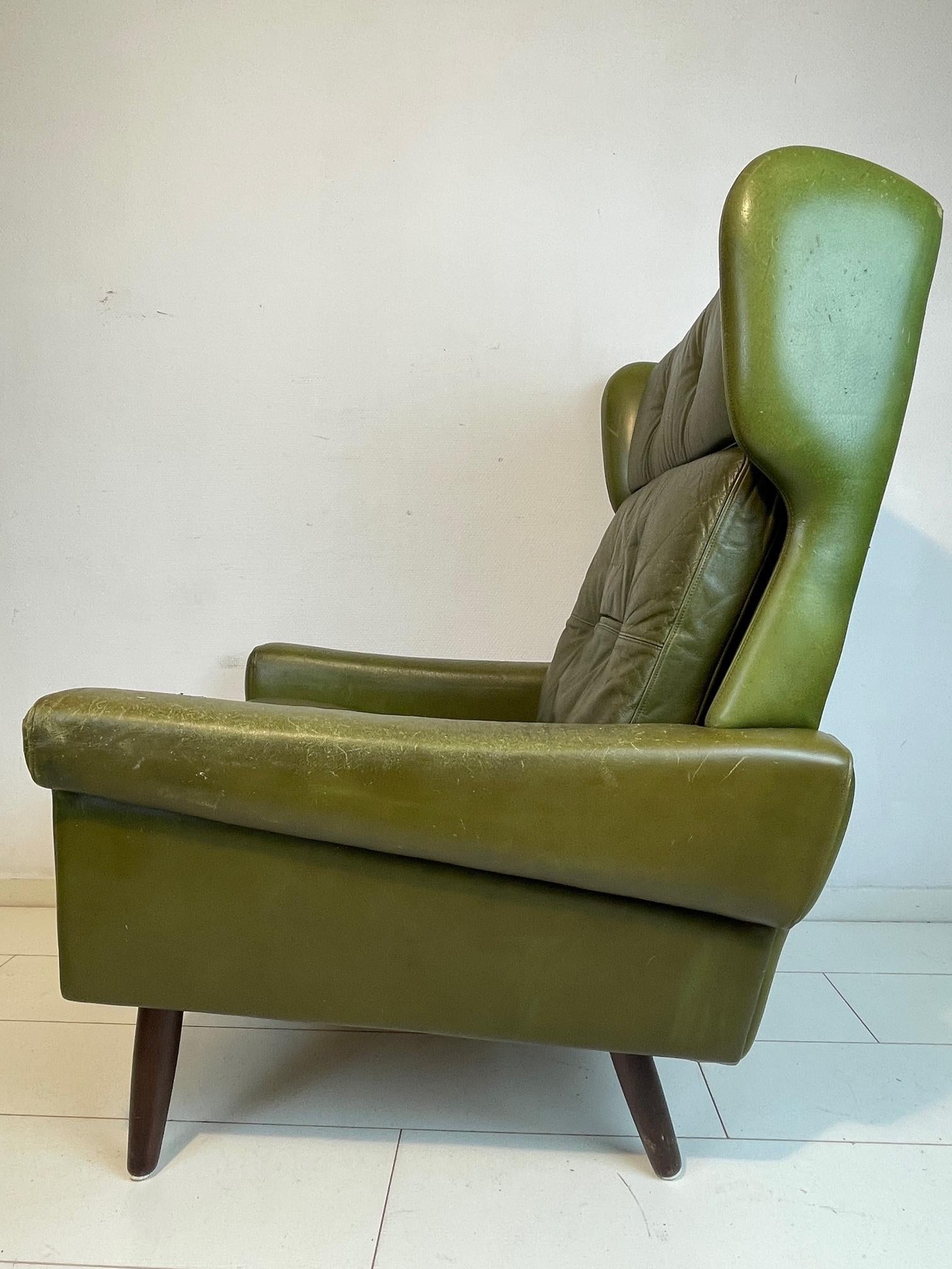 Scandinavian Modern Vintage wingback lounge chair by Svend Skipper, 1960’S Green Leather with hocker