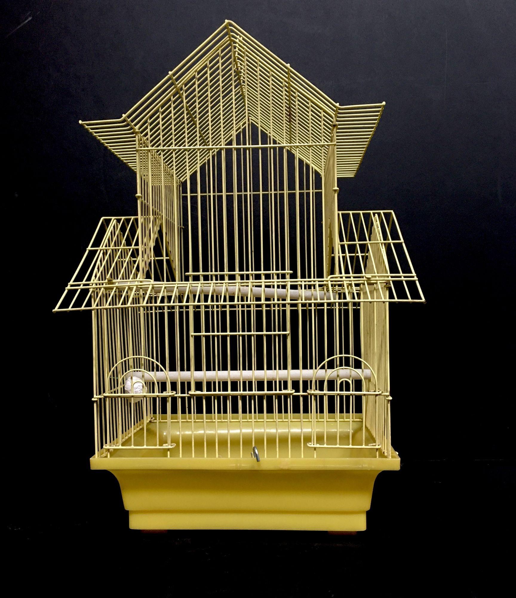 Vintage wire house birdcage double roof in yellow with accessories. $145
 
This wire birdcage comes with 2 plastic perches, removable grille and pullout debris tray which makes it for an easy cleaning process. The wire has been powder coated for a