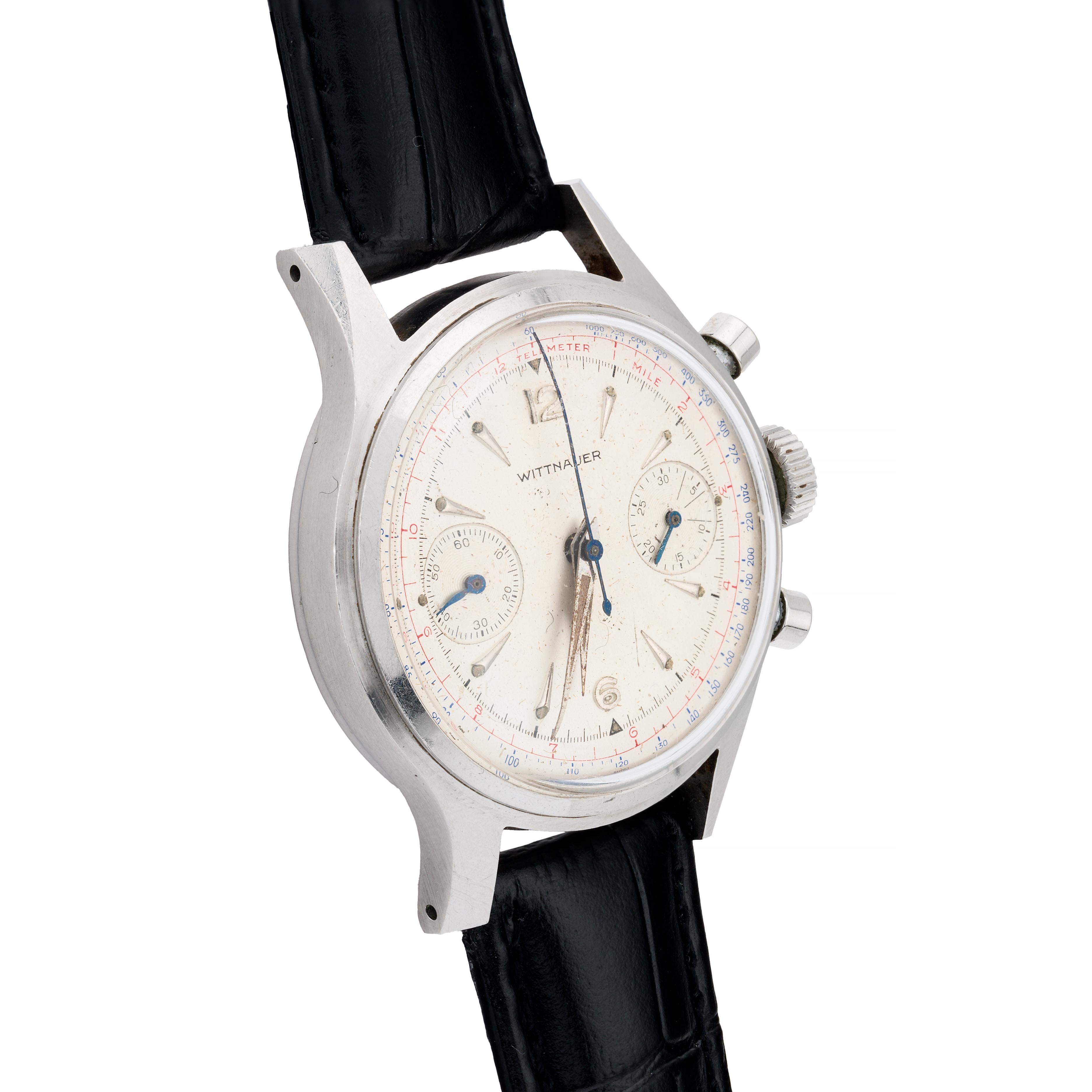 Aston Estate Jewelry Presents:

A Wittnauer chronograph wrist watch crafted in stainless steel.

The round case measures 35mm in width, featuring a white dial adorned with arrow markers. The dial includes chronograph subdials, adding functionality