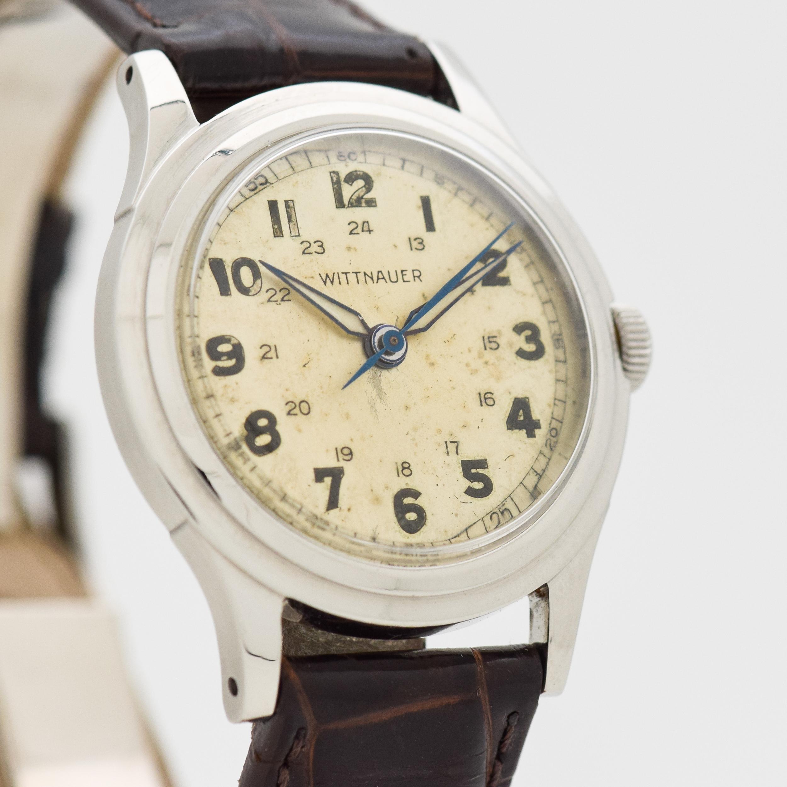 1940's Vintage Wittnauer WWII-era Military-style Stainless Steel watch with Original Silver Dial with Luminous Arabic Numbers. 33mm x 39mm lug to lug (1.3 in. x 1.54 in.) - 15 jewel, manual caliber movement. 100% Genuine Crocodile Glossy Dark