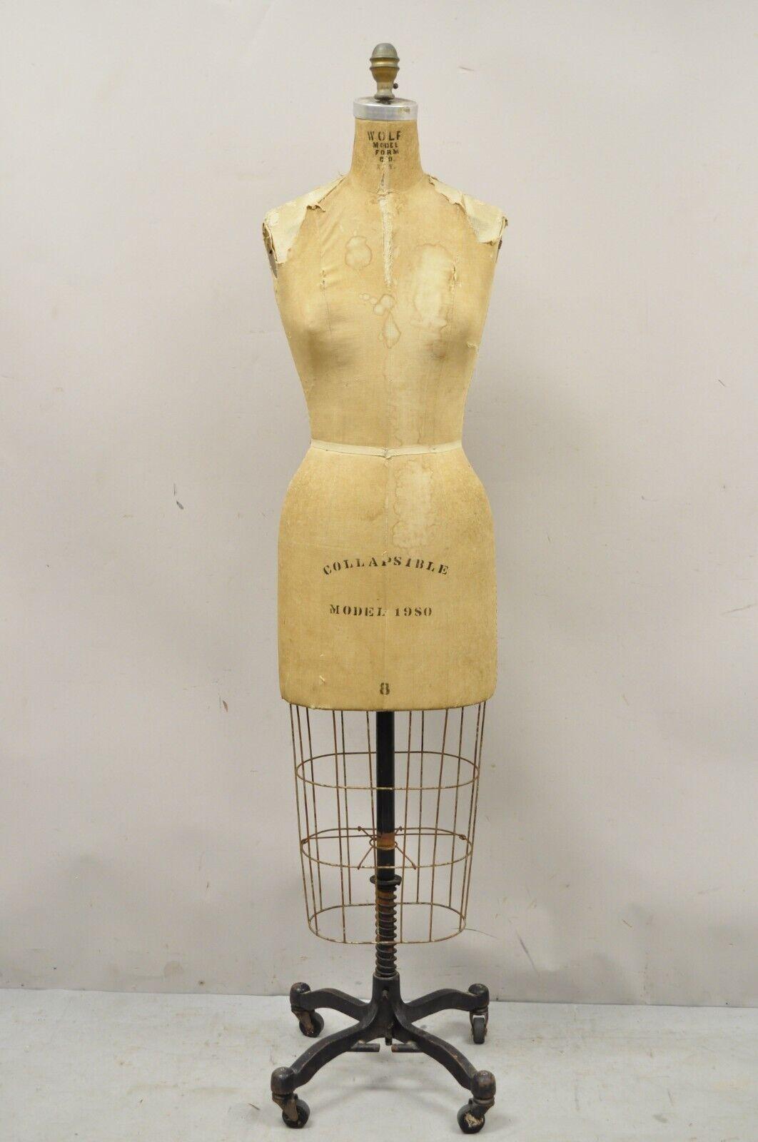 Vintage Wolf Model form model 1980 size 8 dress Form Mannequin. Item features a metal cage base, rolling casters, original stamp, very nice vintage item, great style and form. Circa Late 20th Century. Measurements: 63
