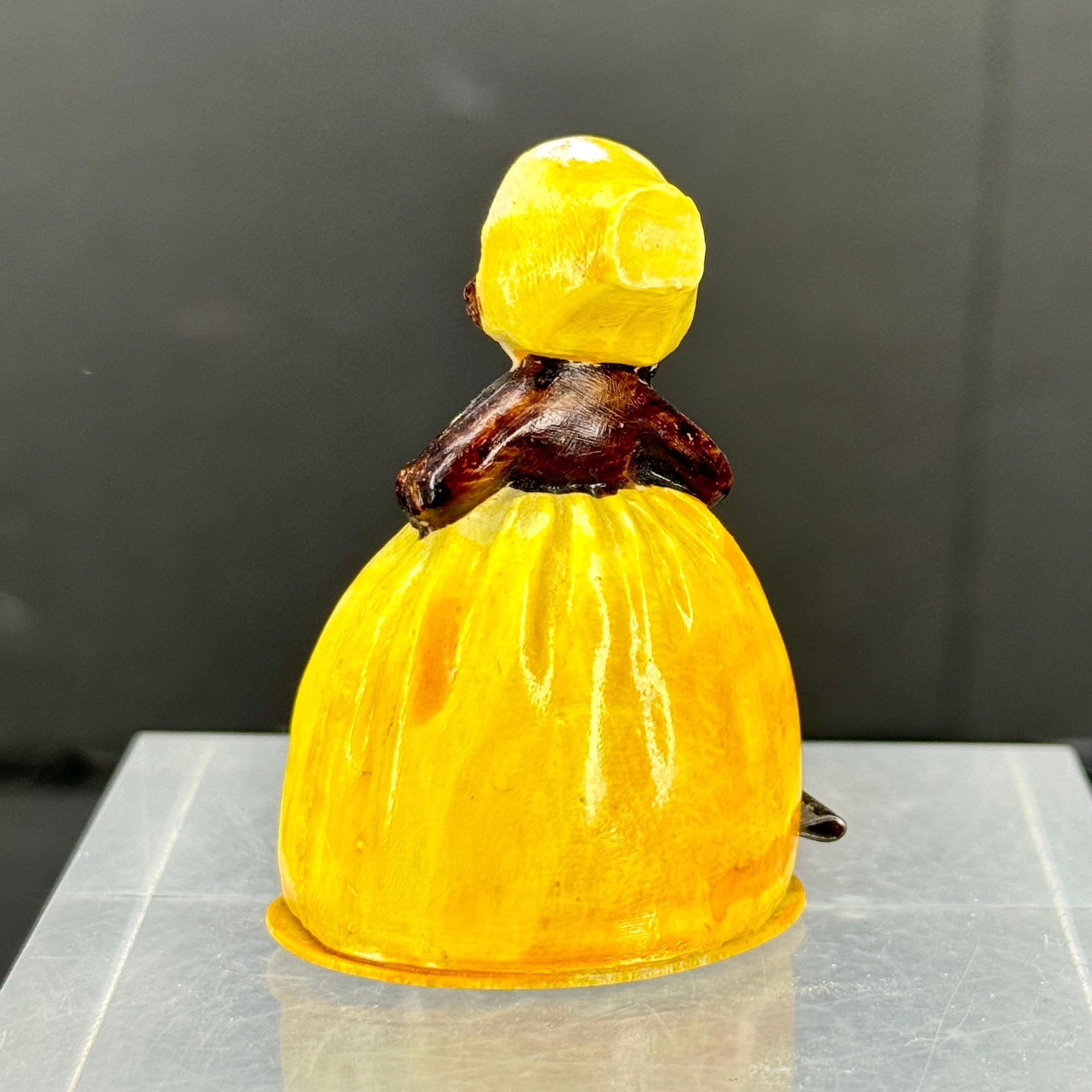 Very charming small figurine of a lady that functions as a tape measure. This vintage piece was commonly found on a sewing table and has both centimeters as well as inch measurements. Super cute piece to keep on a desk area or counter area as well.