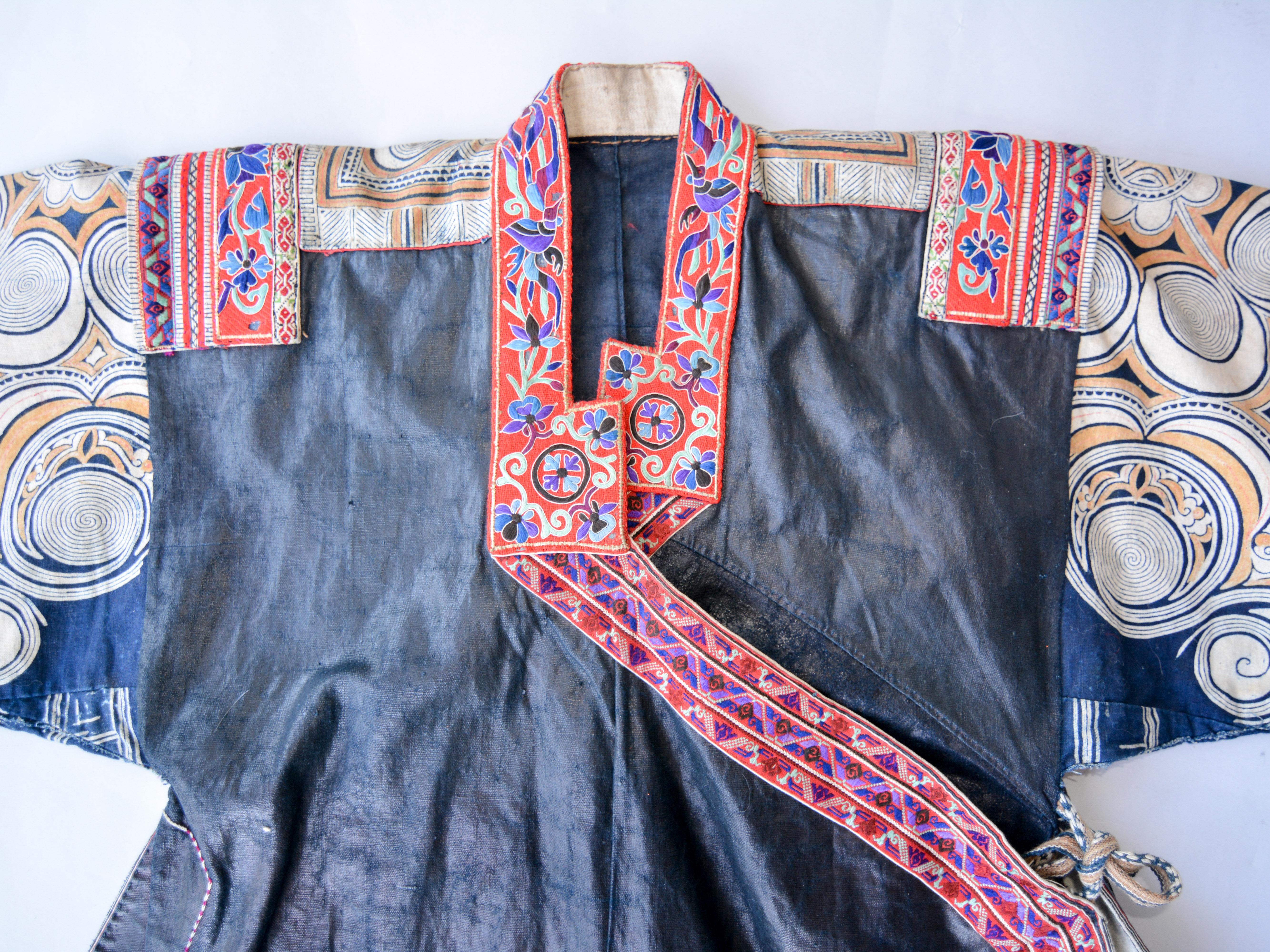 Vintage Women's Jacket. Miao of Da Yun county, south central Guizhou, China, mid-20th century.
Worn on festive occasions, this distinctive jacket is decorated with a batik wax-resist design on the upper sleeves and back in naturally dyed colors.