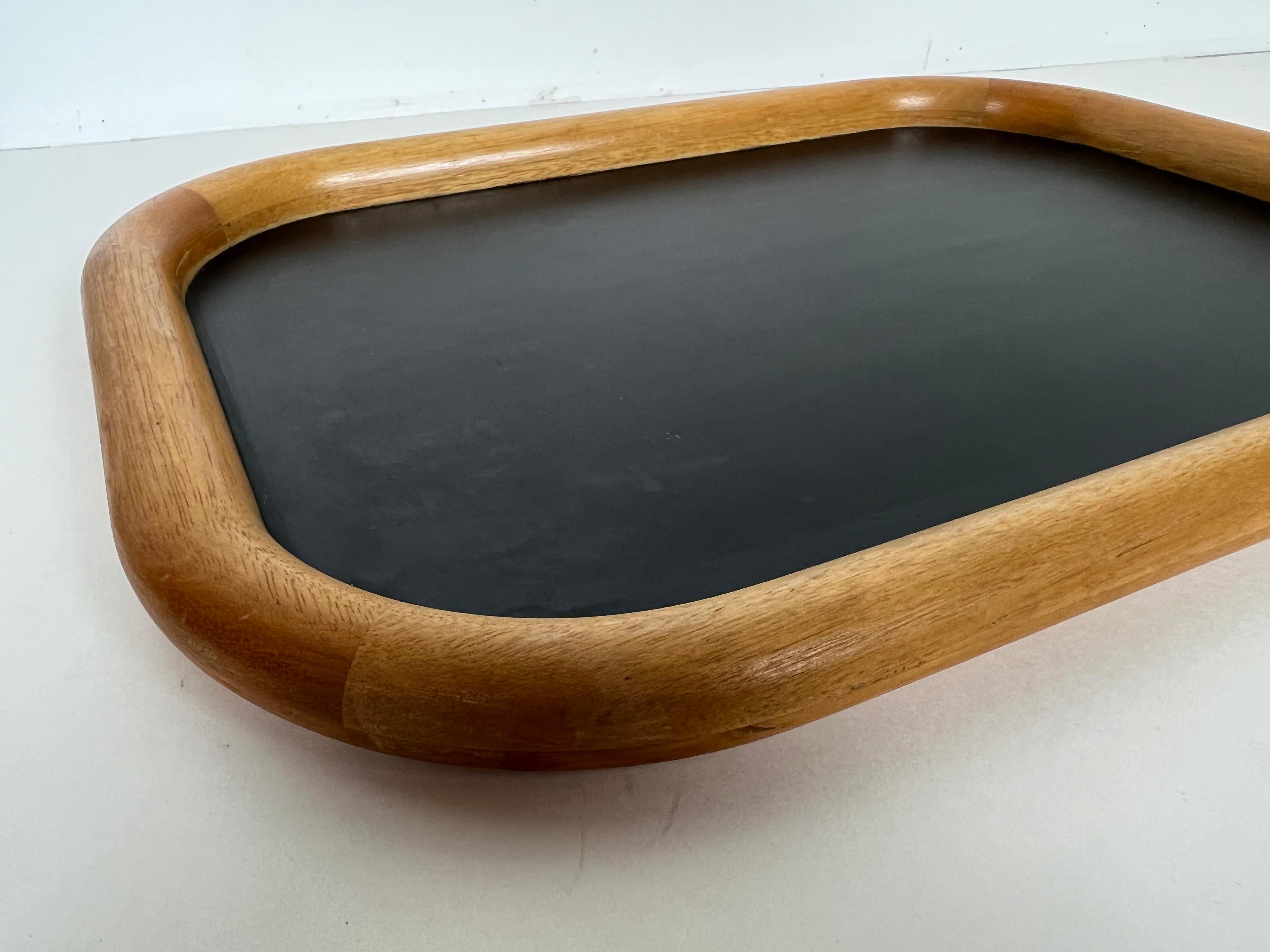 Vintage bentwood serving tray constructed of Kuala wood and a black laminate material by Ernest Sohn.

Manufacturer: Ernest Sohn Creations

Designer: Ernest Sohn

Origin: Cleveland, Ohio. USA

Style: Mid-Century Modern

Dimensions: 18.25