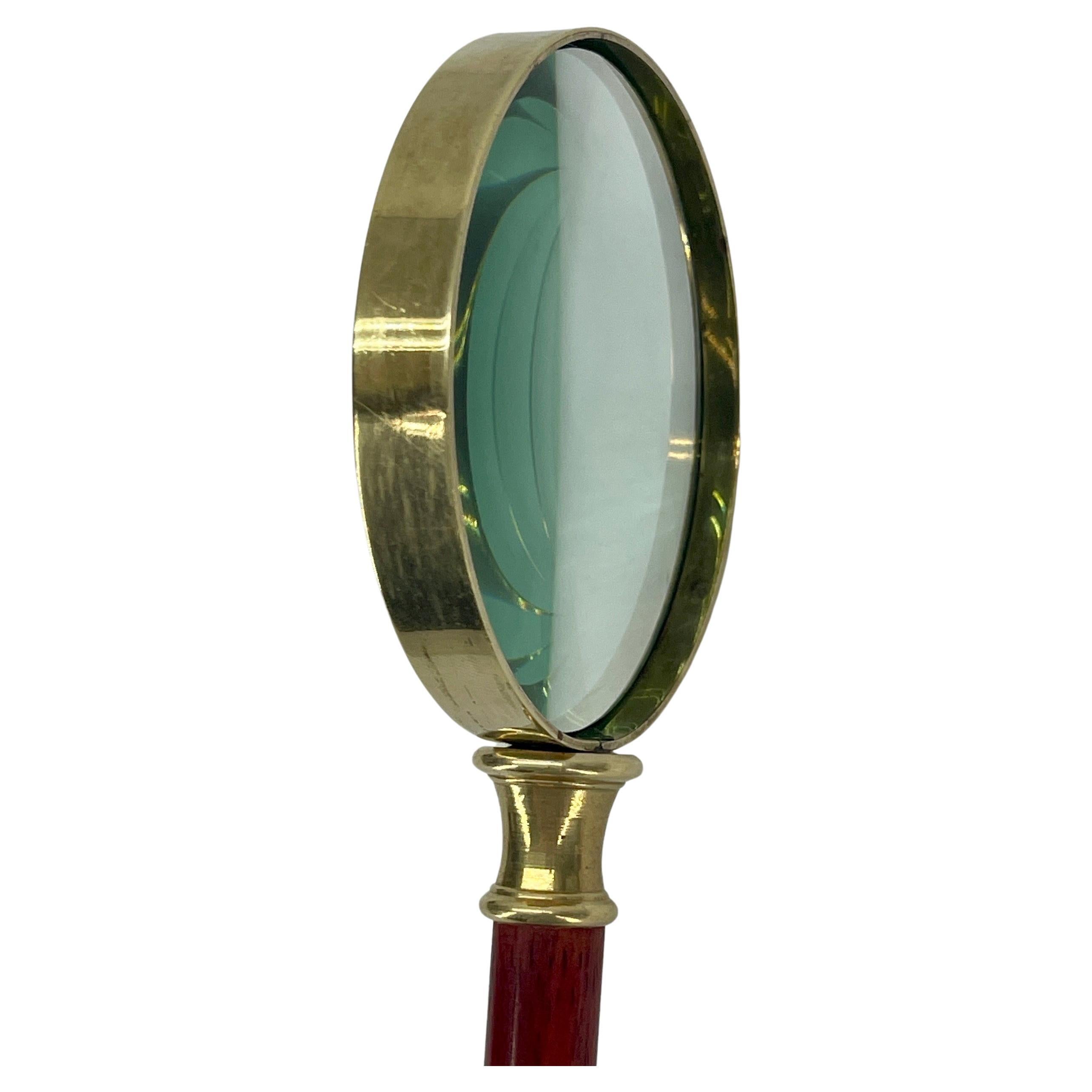 Classic vintage brass and cherrywood magnifying glass.